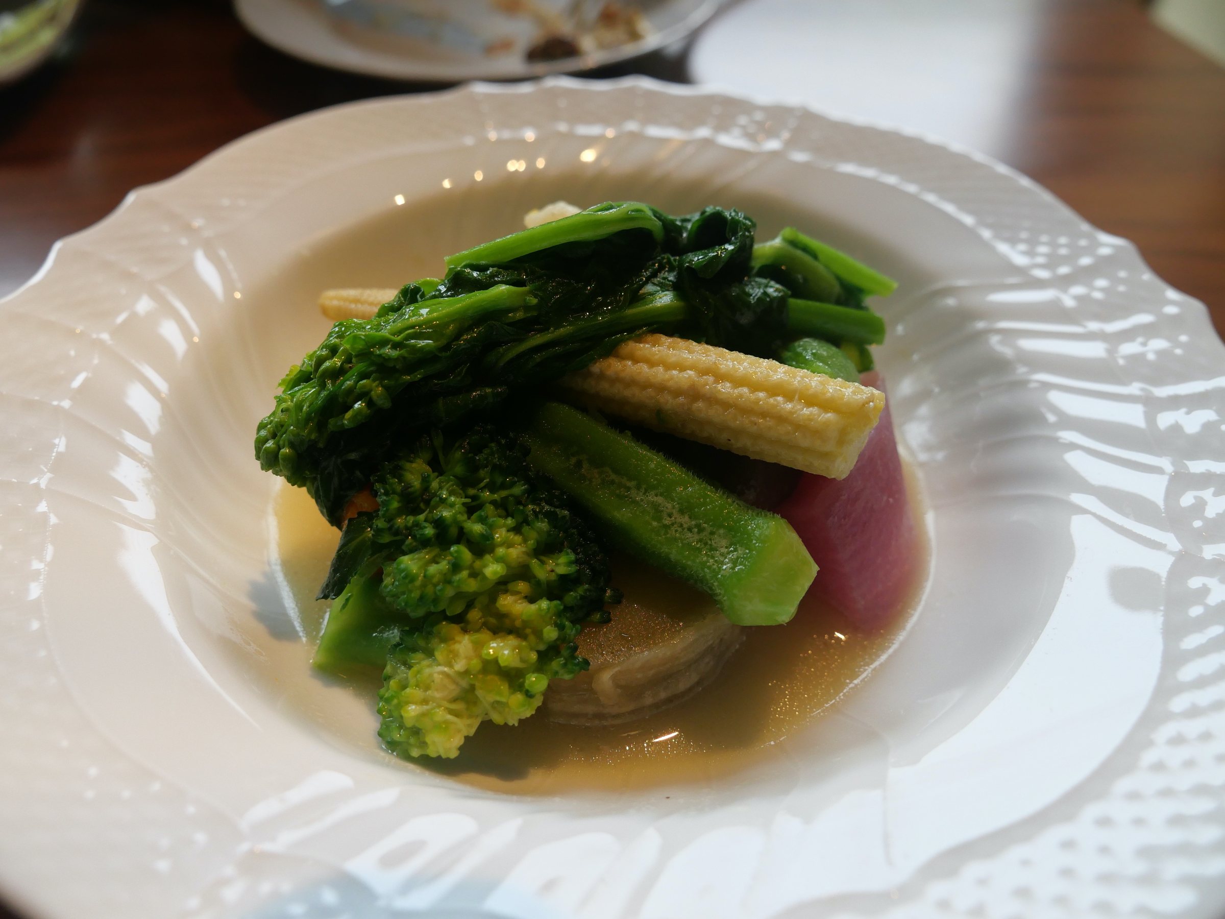 Warm vegetables in consommé.