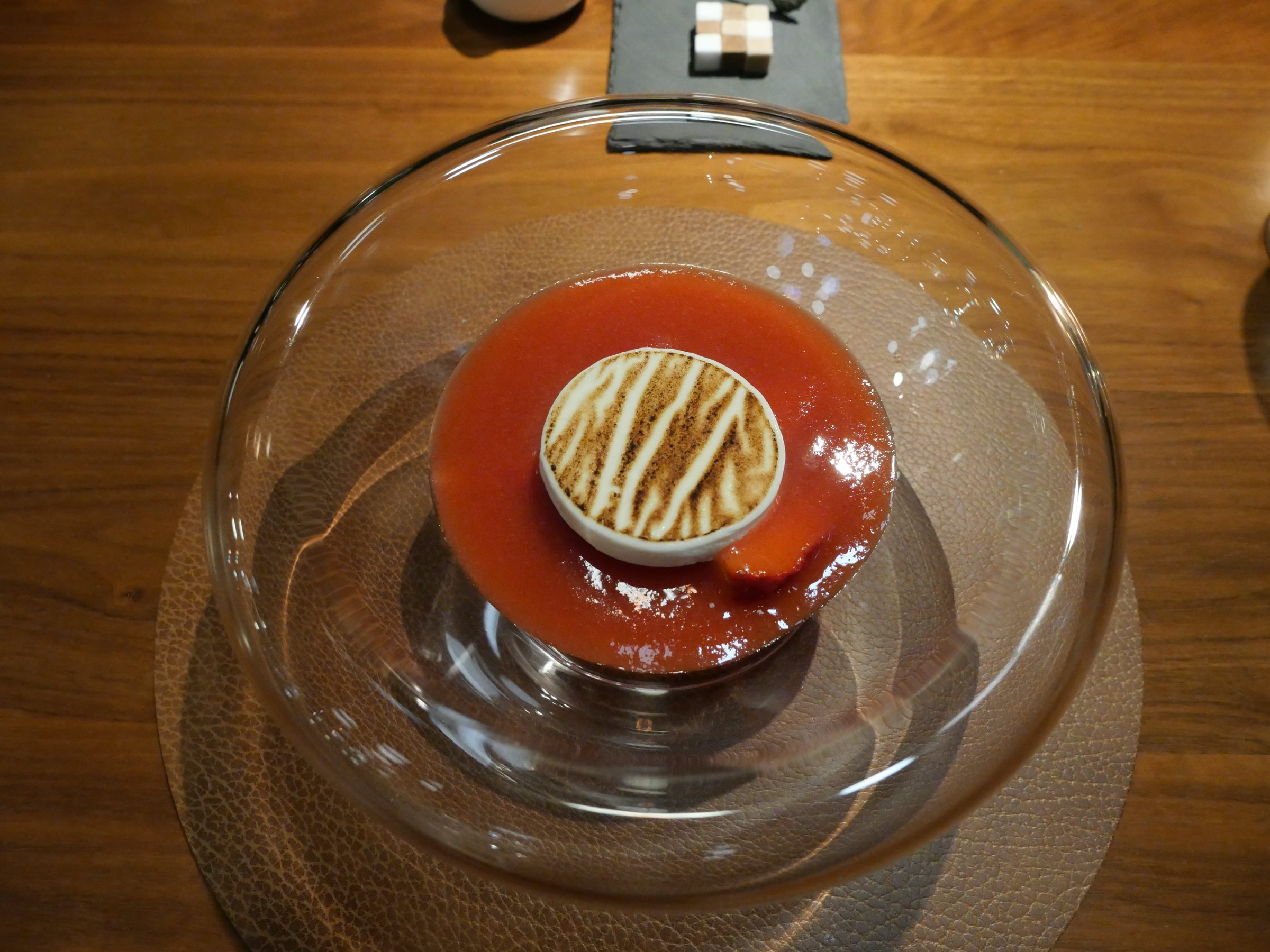 Soufflé with strawberry sauce.