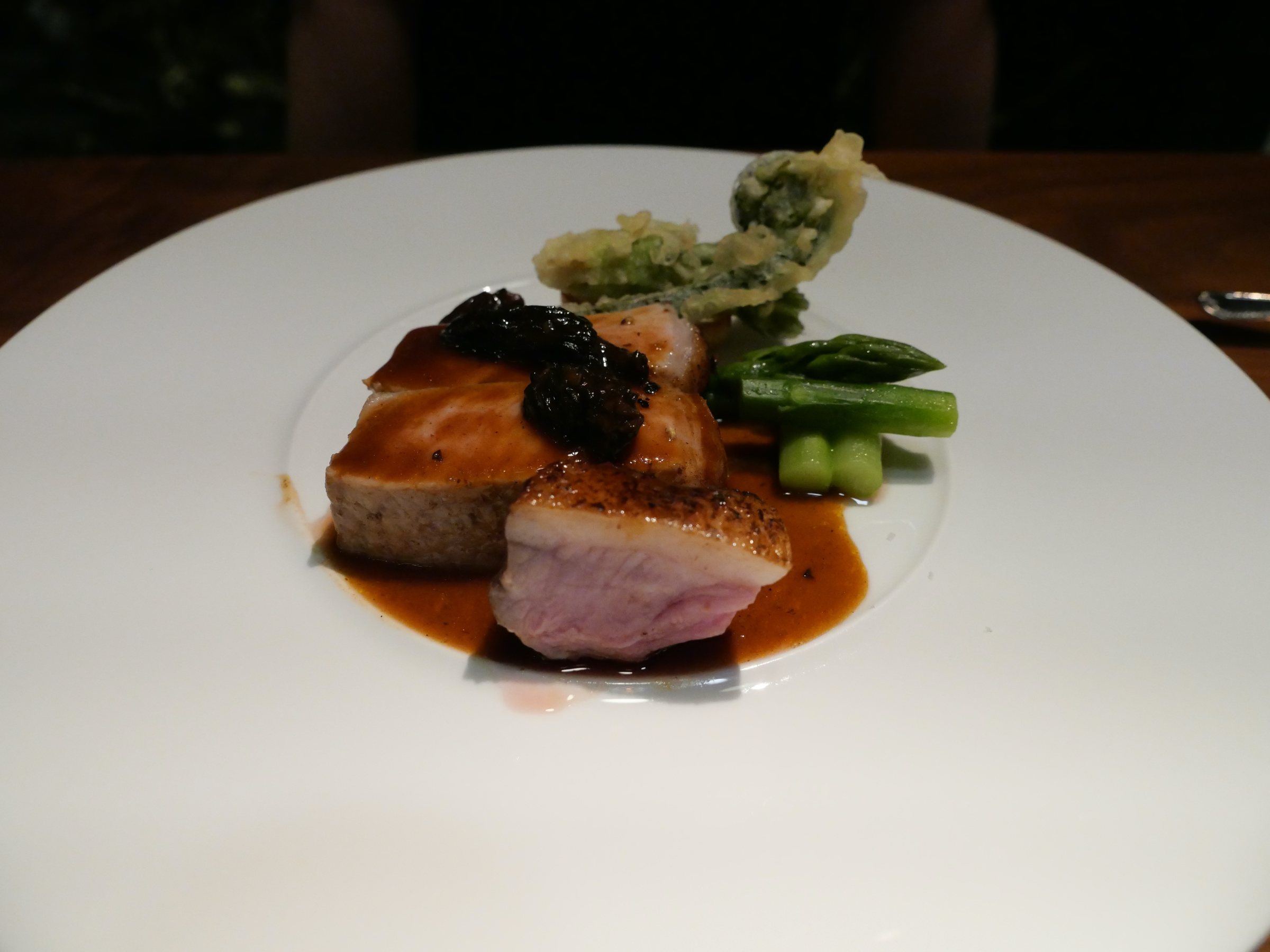 Roast pork loin with mountain-vegetable tempura and morel sauce.