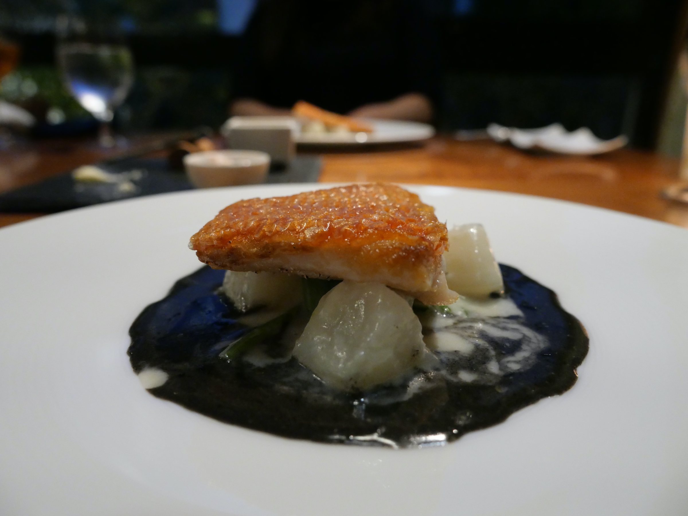 Kinmedai poêlé with squid ink and butter sauce.