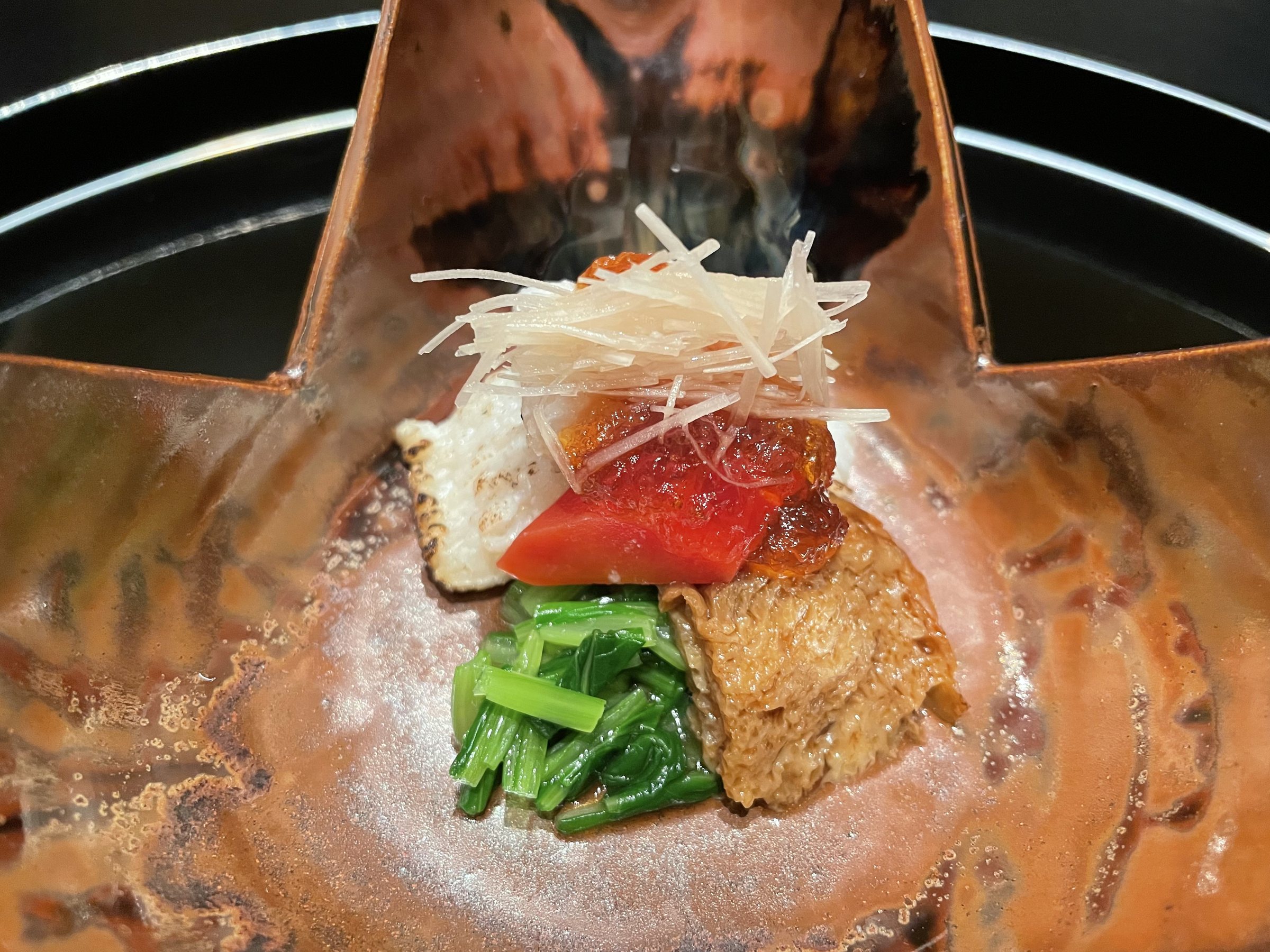 The first course, the vinegared mukozuke, in a copper-toned dish.