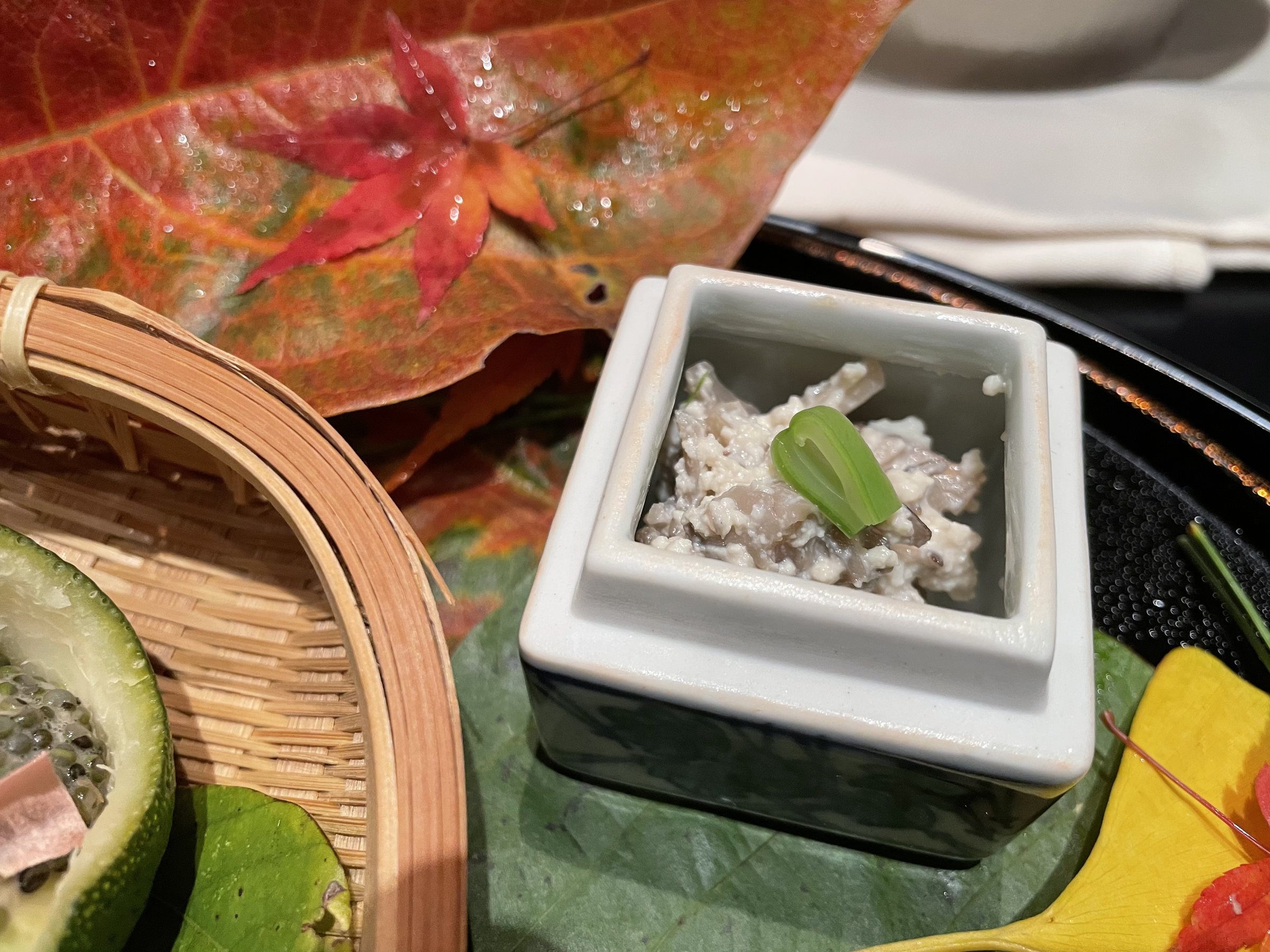 Maitake mushrooms in shira-ae, in the square dish.