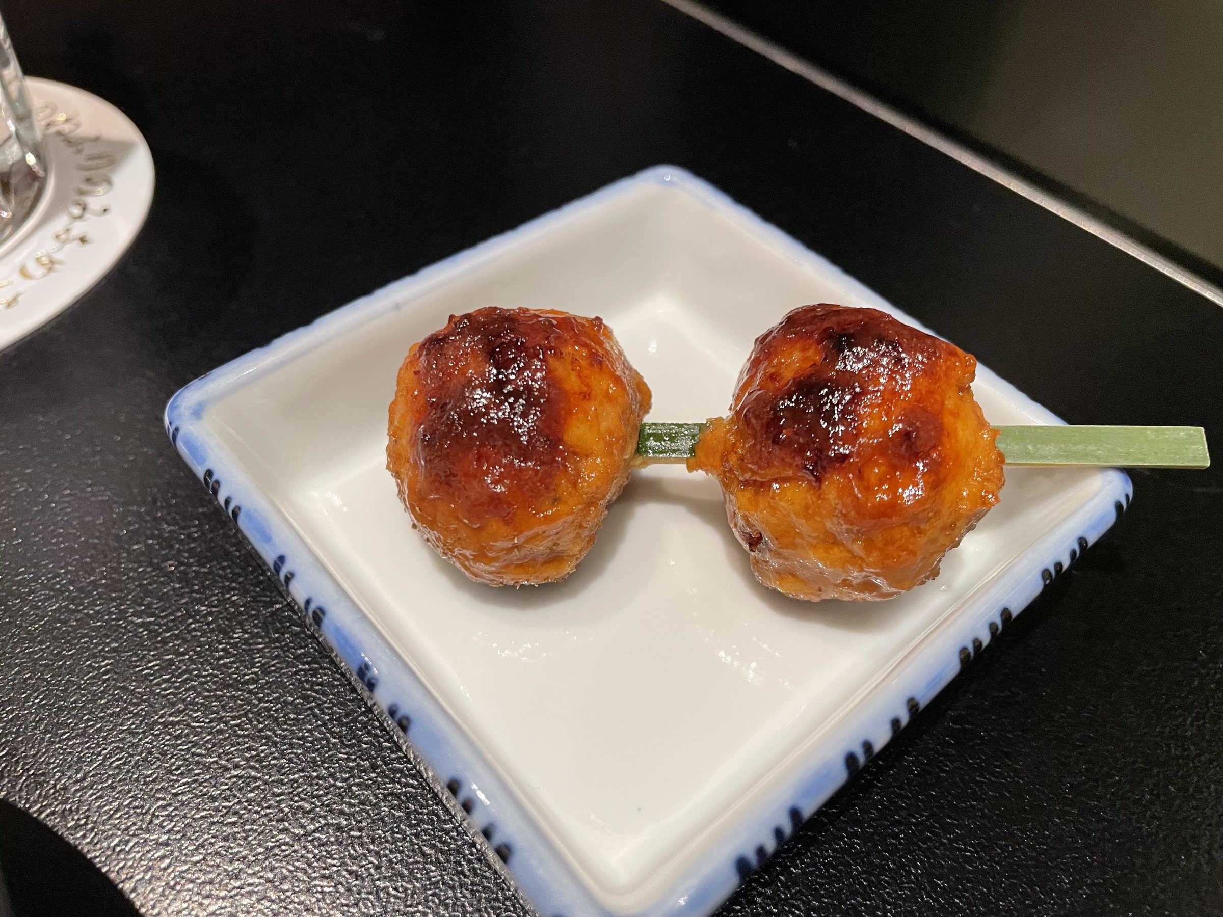 Duck tsumire, glazed on a skewer.