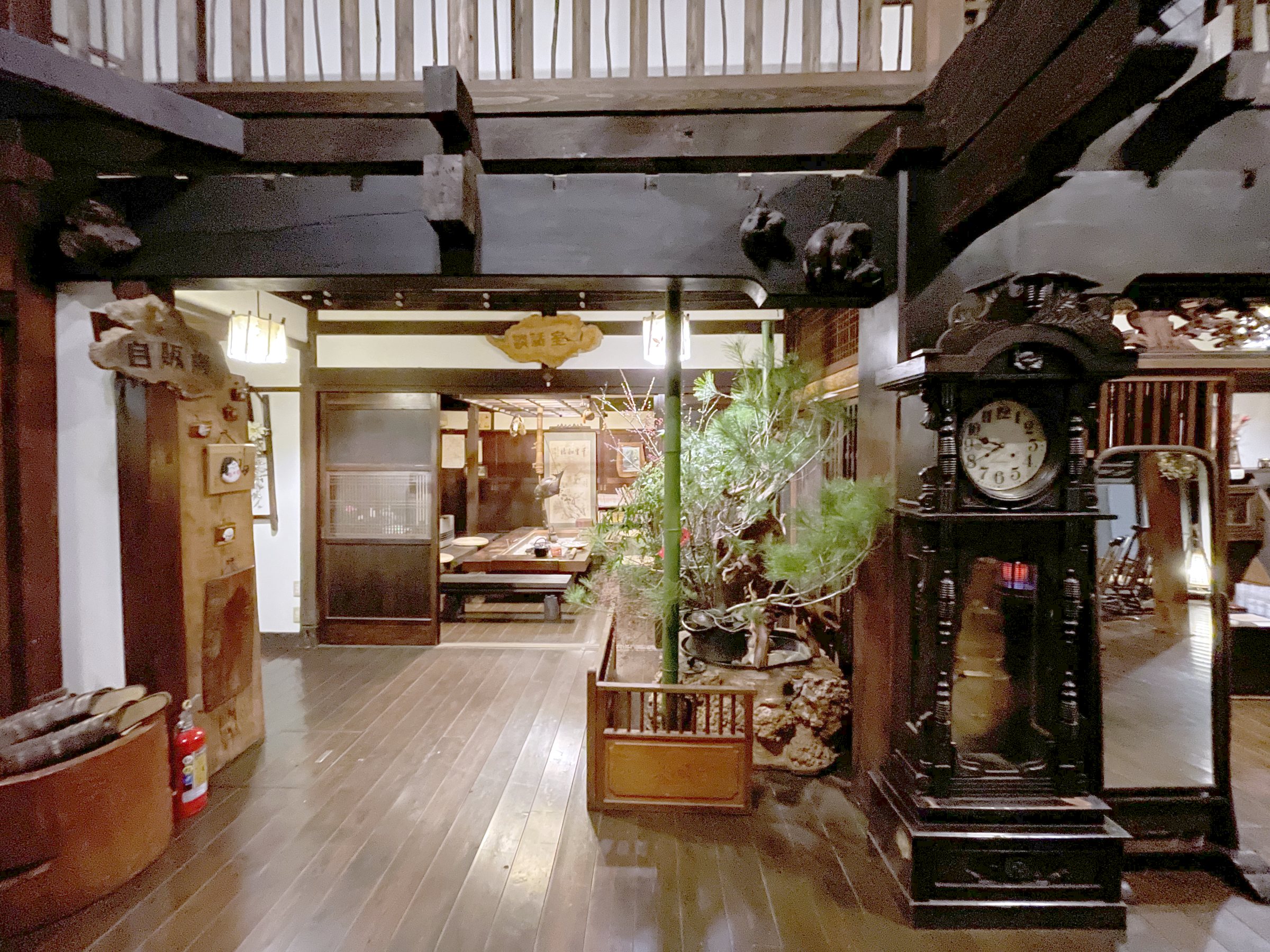Gleaming wooden floors, a pine in a planter and an old long-case clock in the entrance hall.