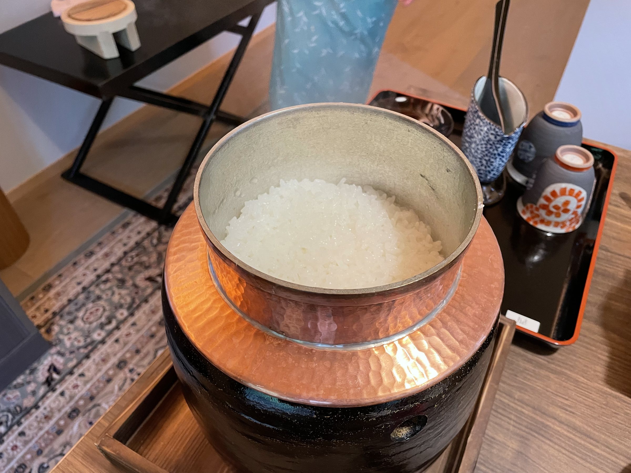 Freshly cooked rice in a copper-lined pot.