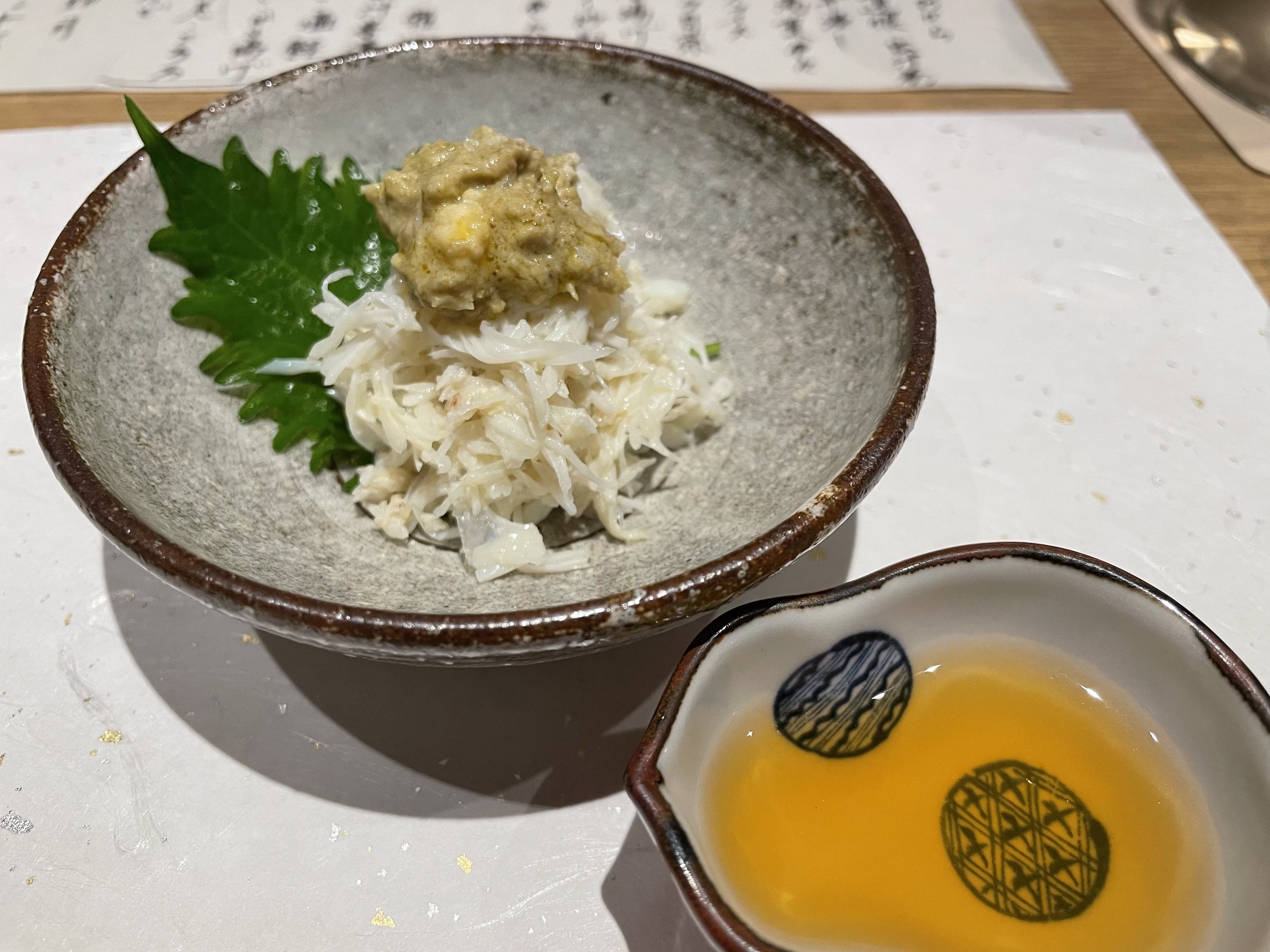 Crab with crab miso, and a small lipped bowl of crab vinegar.