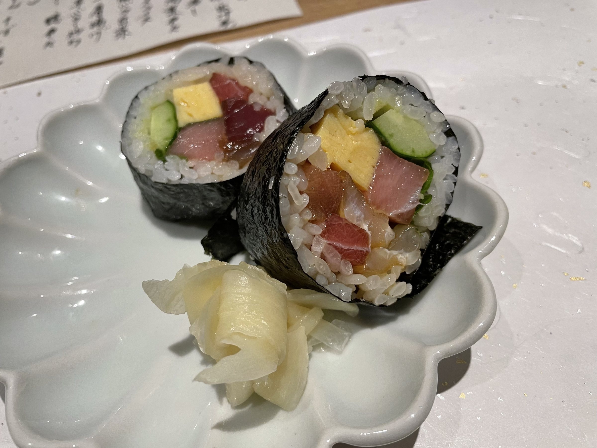 Thick rolls filled with omelet, cucumber and fish.