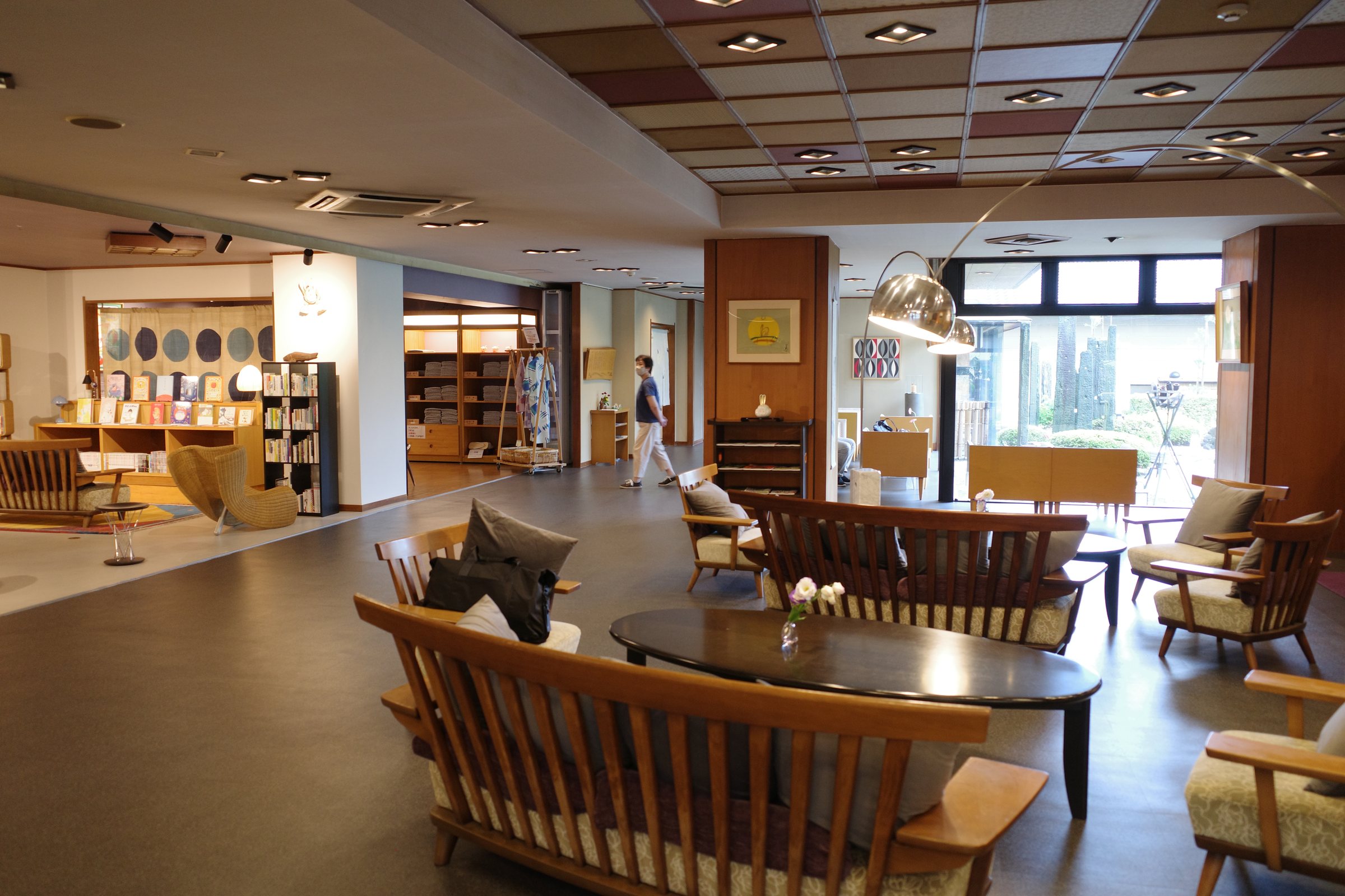 The spacious lobby, with low wooden sofas and a coffered ceiling.