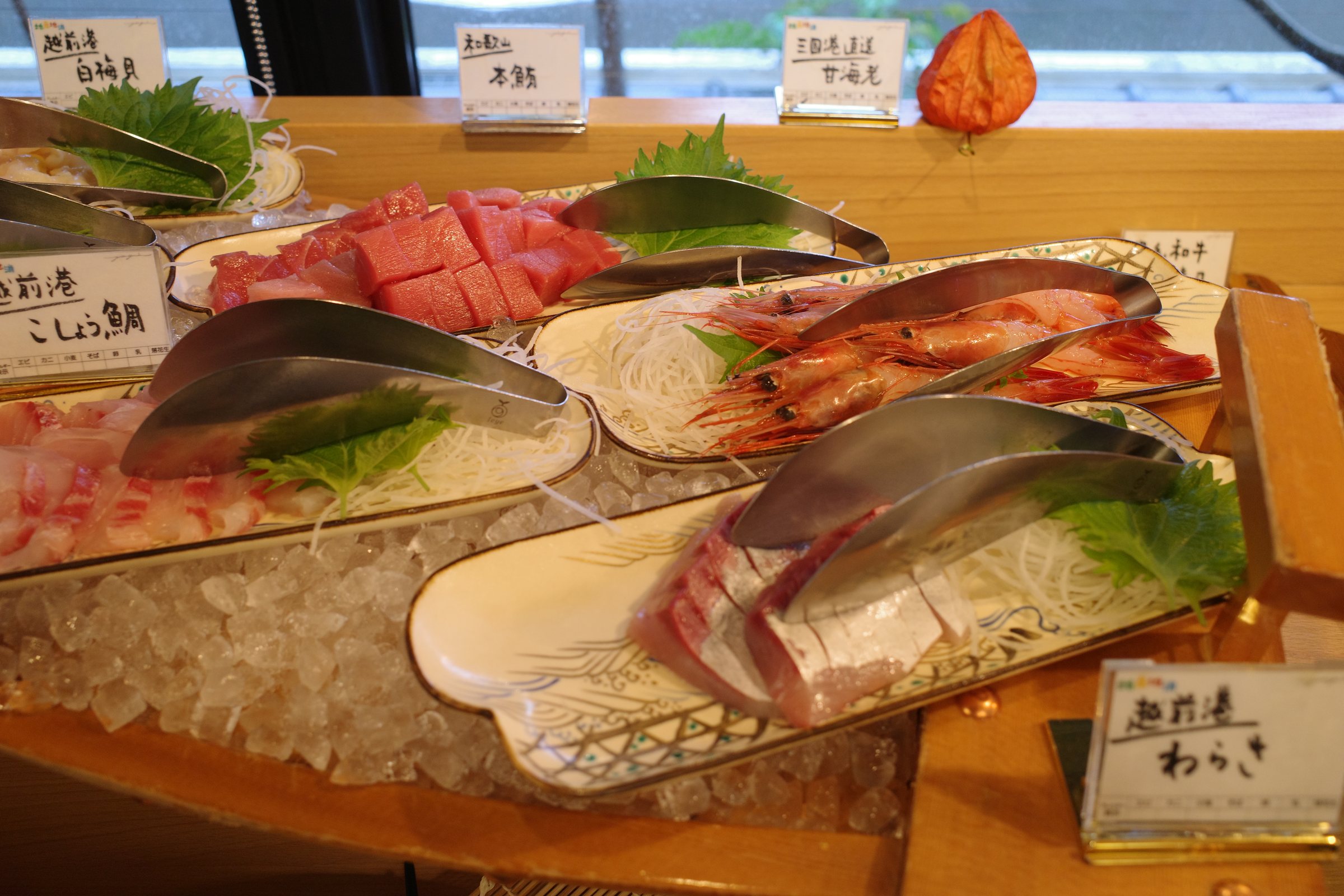 Sashimi of tuna, sea bream and mackerel on the boat.