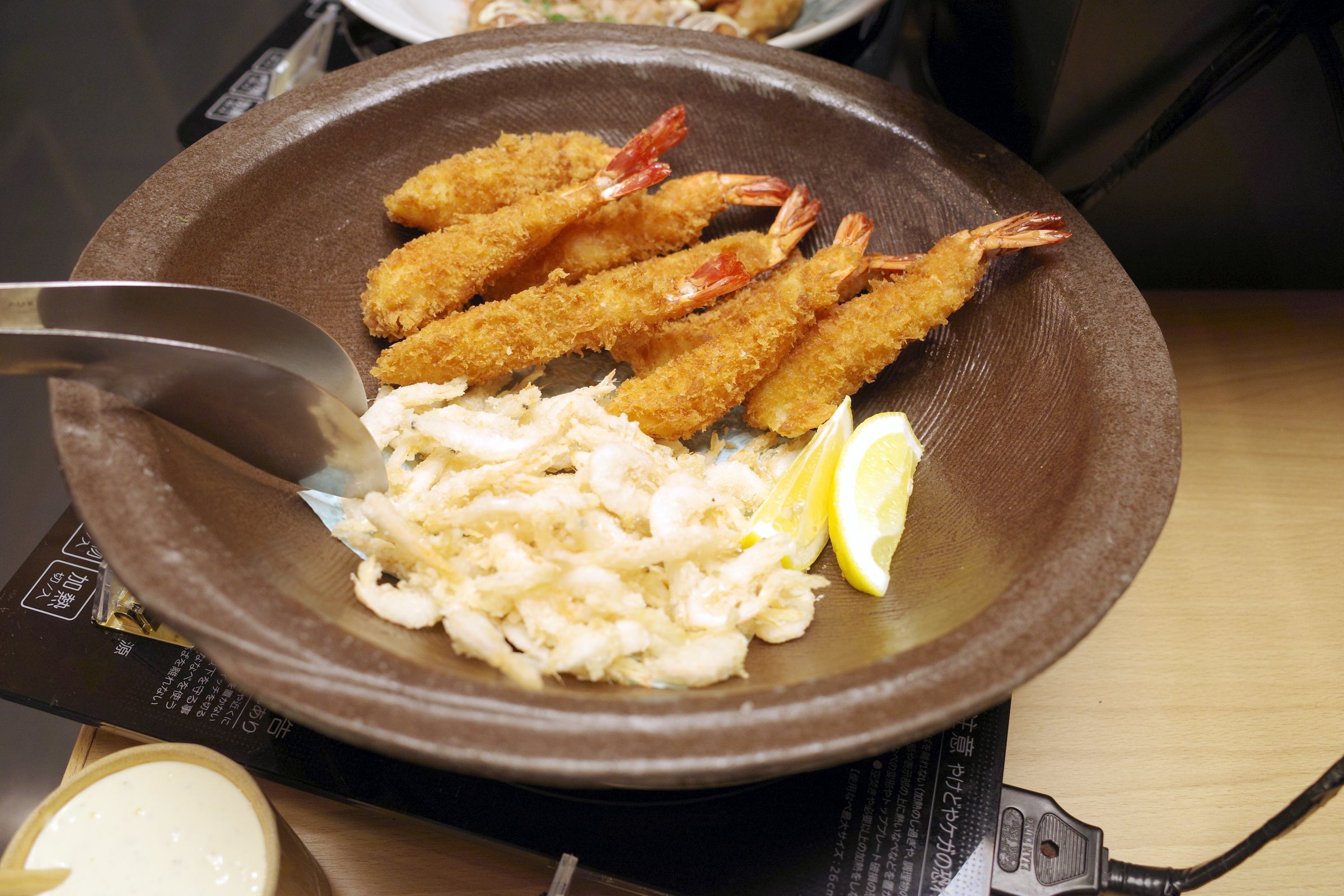 Fried prawns on the hot counter.