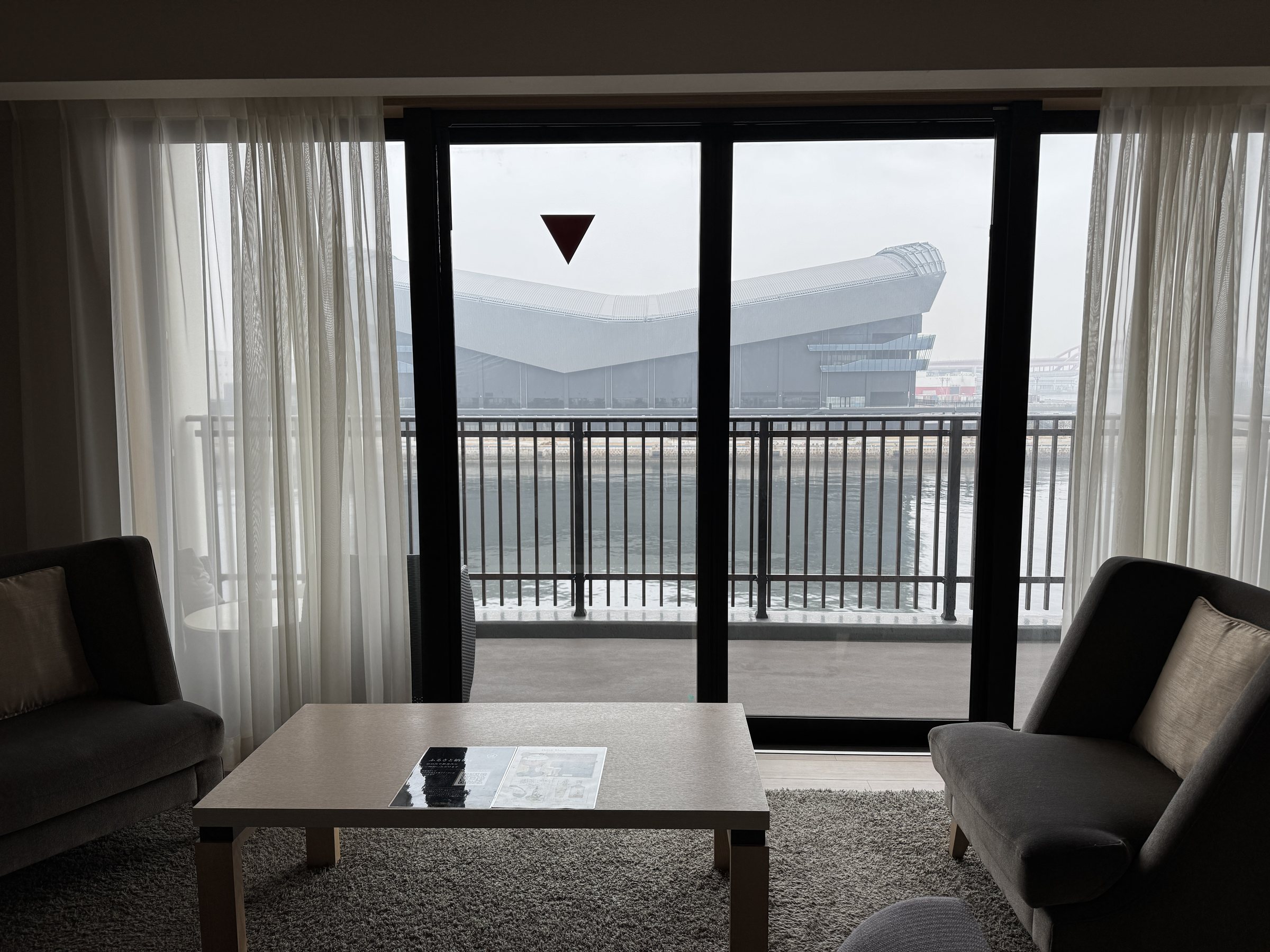 The arena across the water, framed by the living-room window.