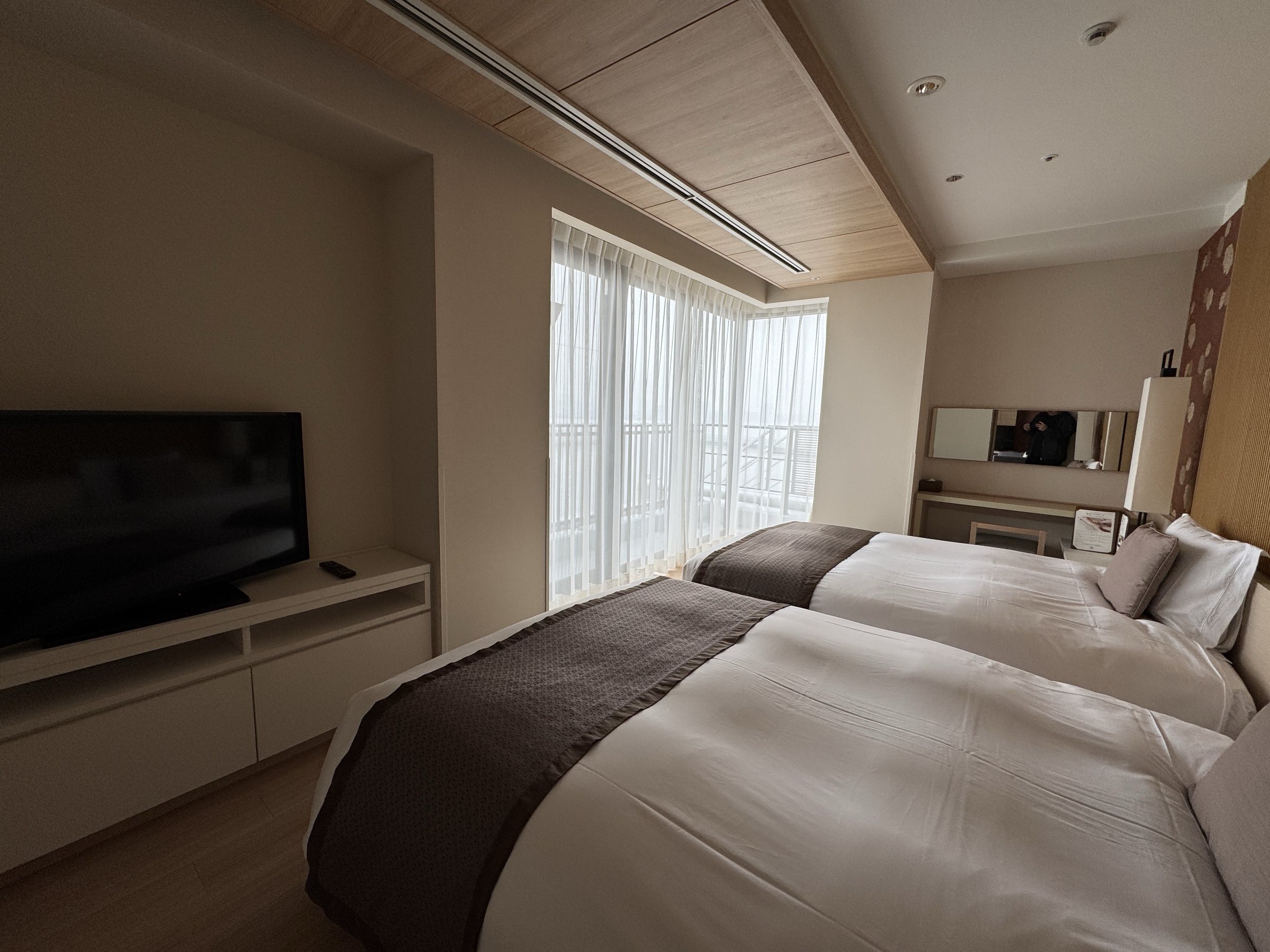 The beds face the windows, with a television opposite.