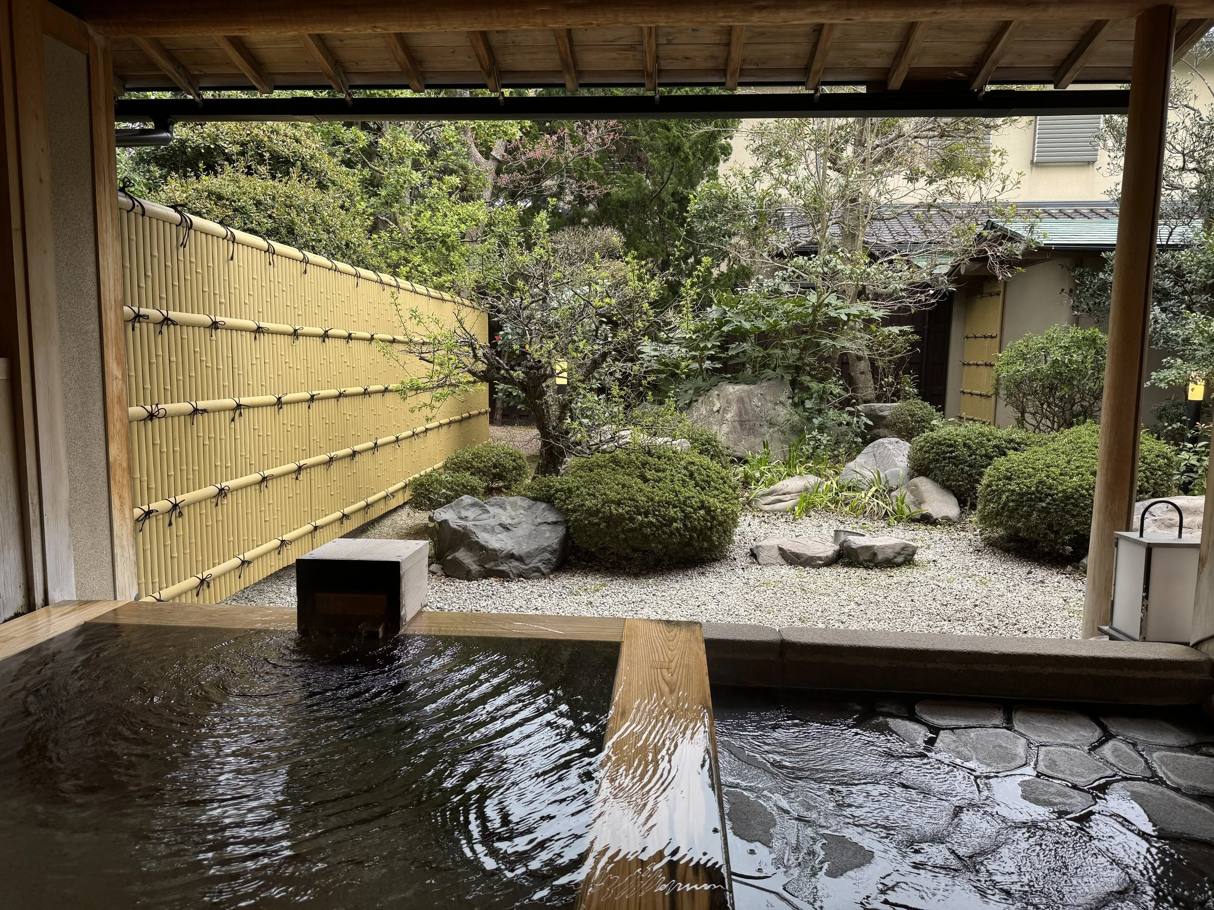 The open-air bath, facing a walled garden.