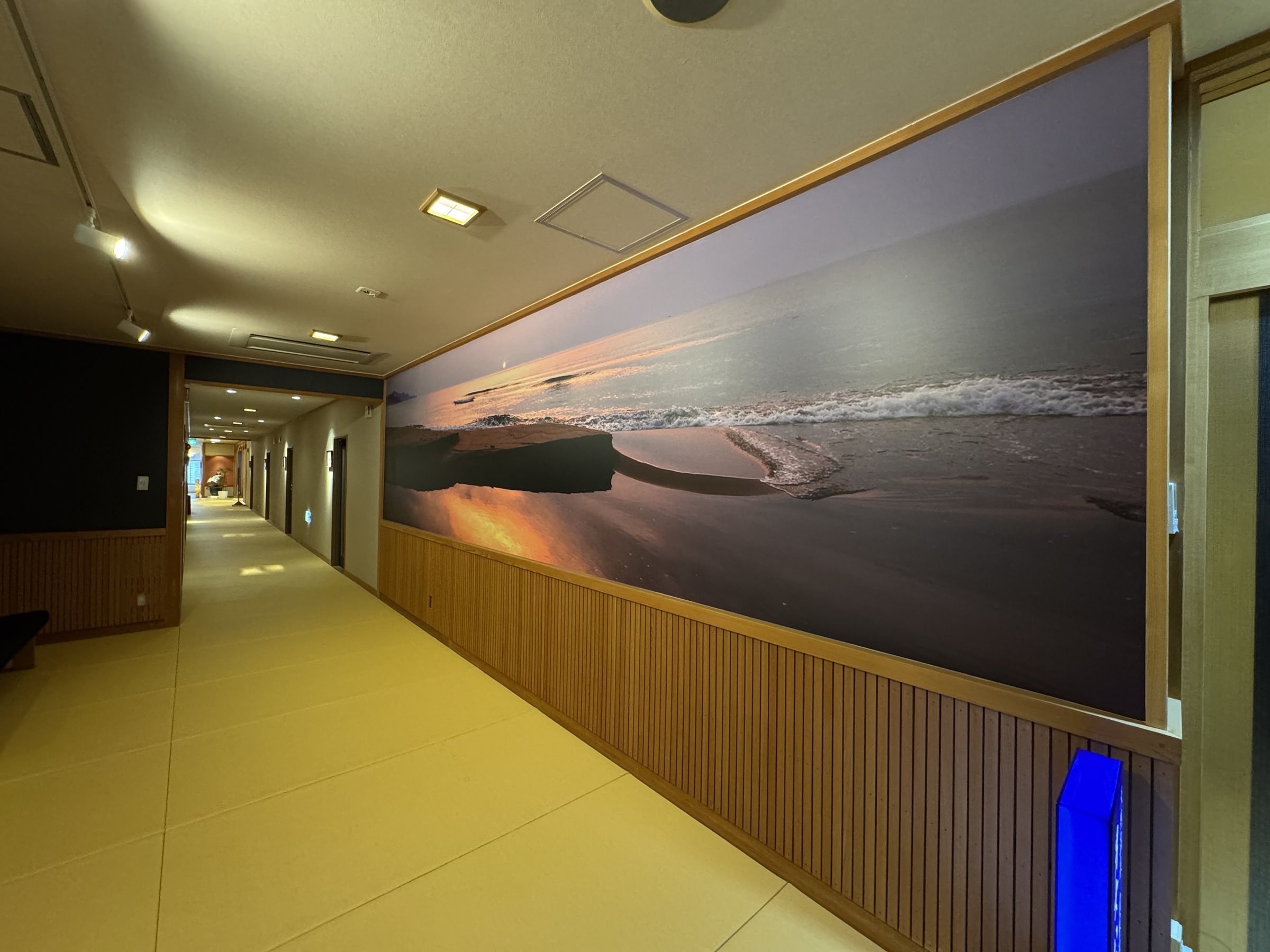 A tatami corridor in soft amber light.