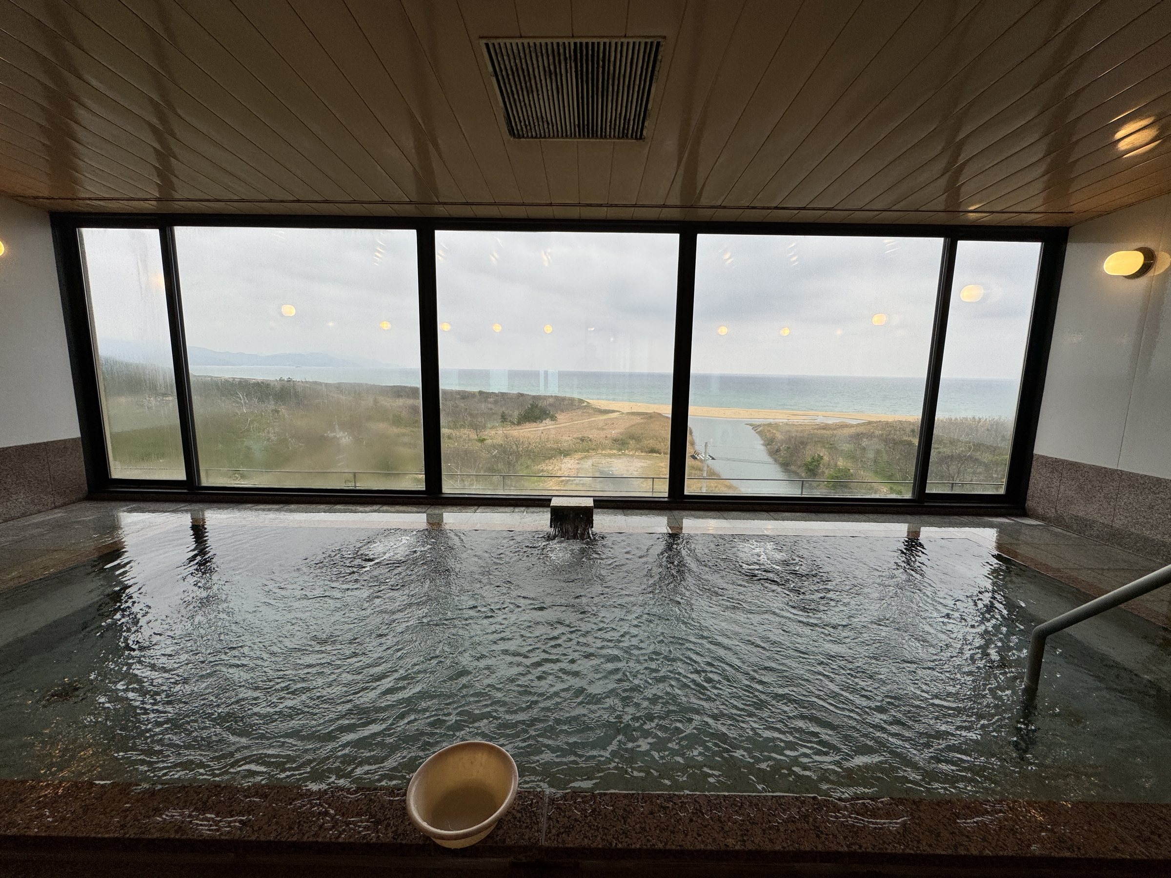 One of the main baths, its wide window looking out over the dunes to the sea.