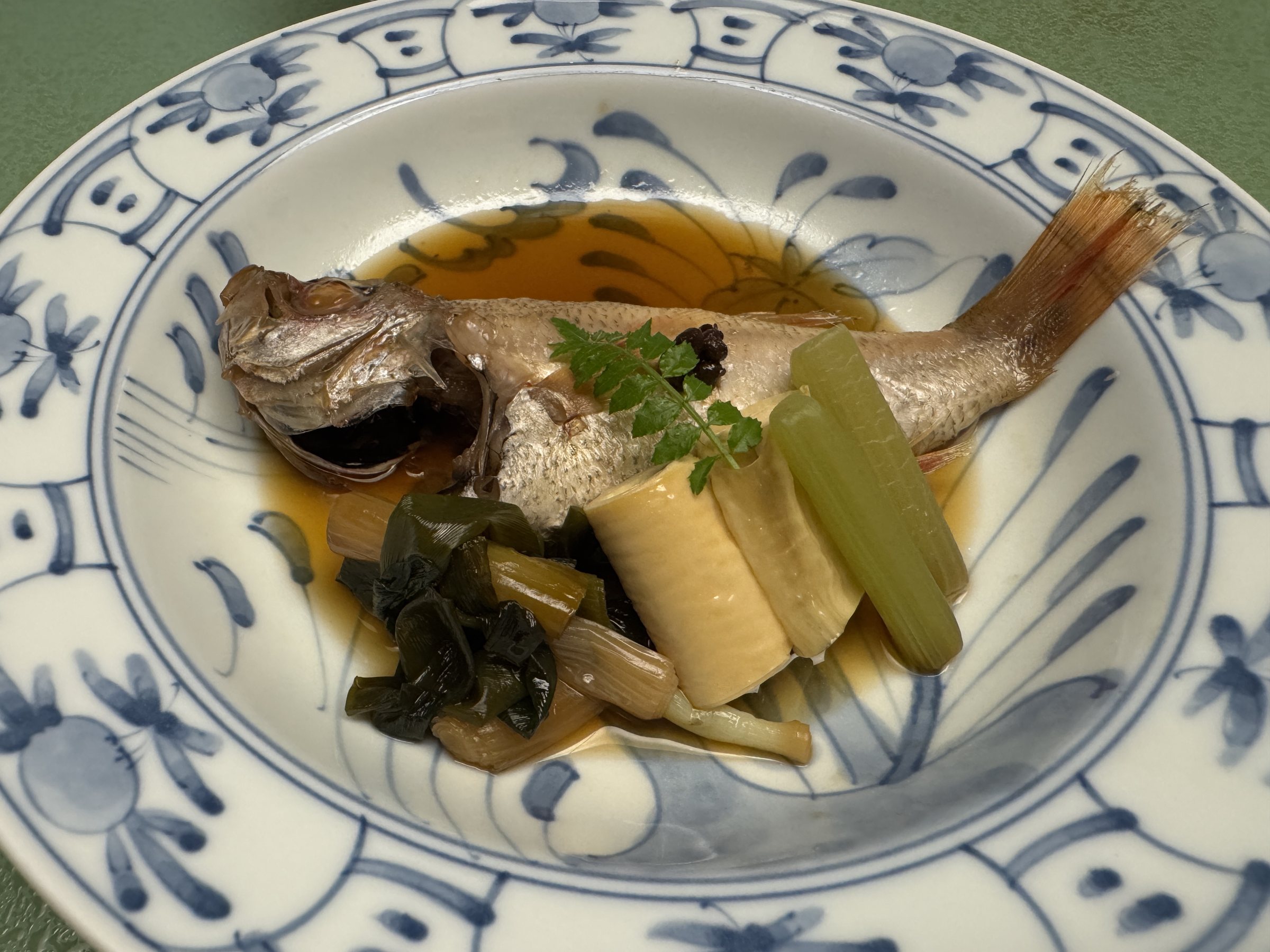Simmered nodoguro with yuba and greens.