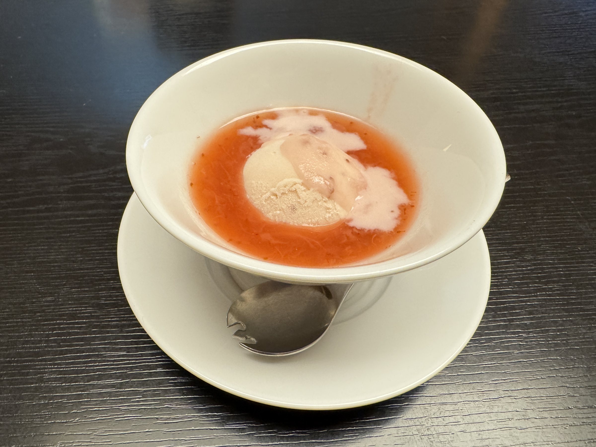 Dessert: ice cream in a red fruit sauce.