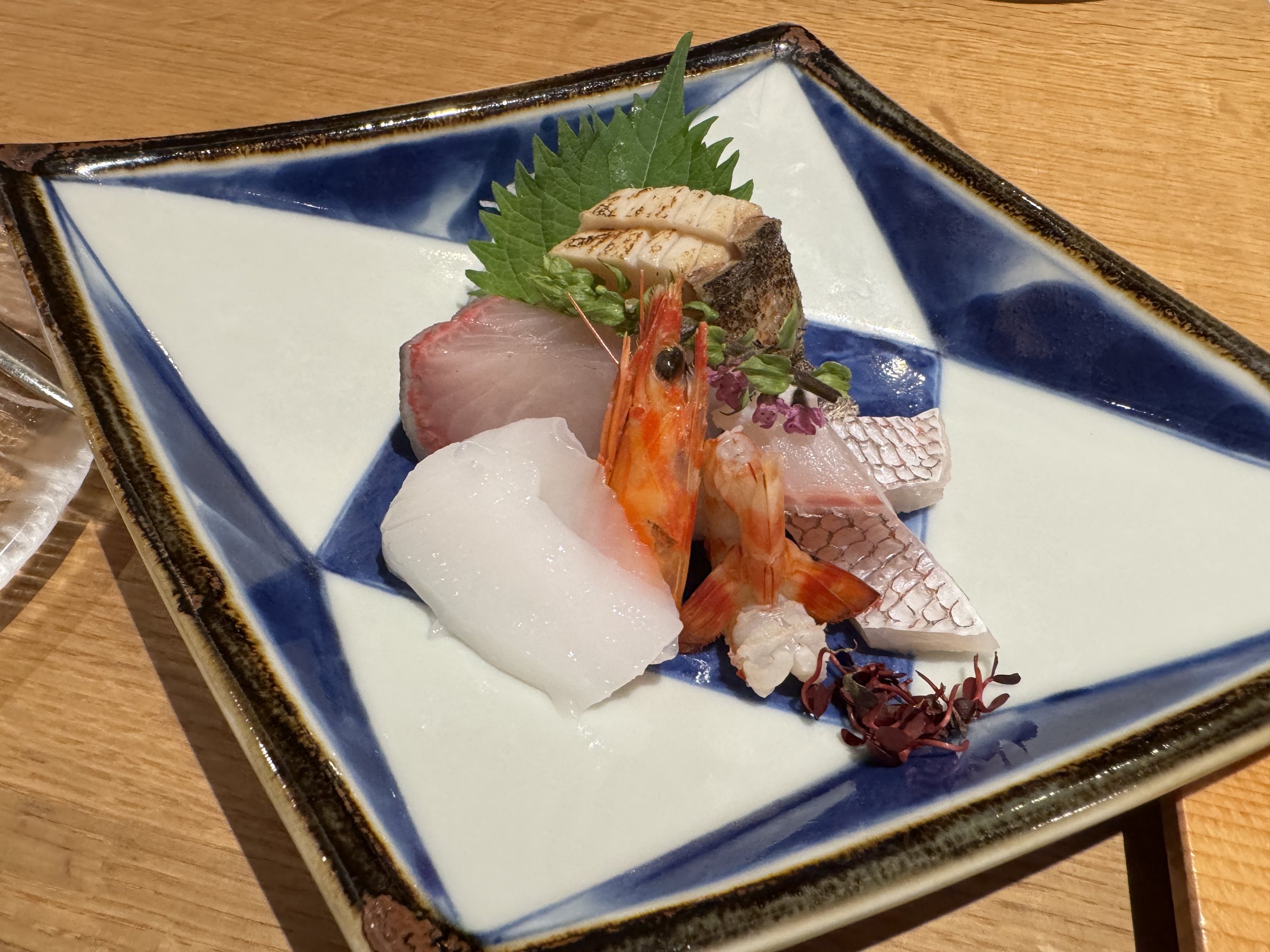 Sashimi of prawn, squid and white fish.