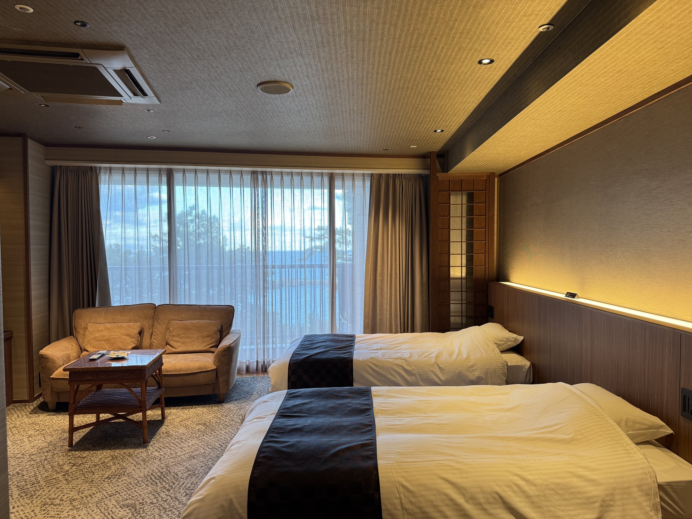 Our room: twin beds and a sofa by the window.