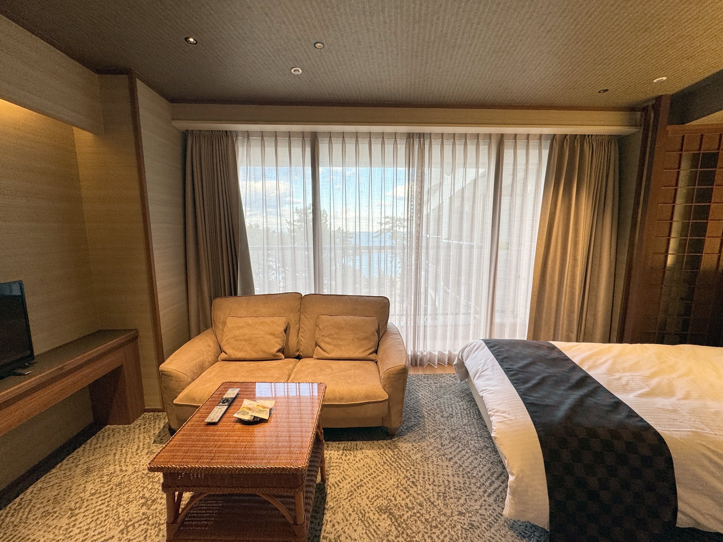 A sofa and low table by the window.