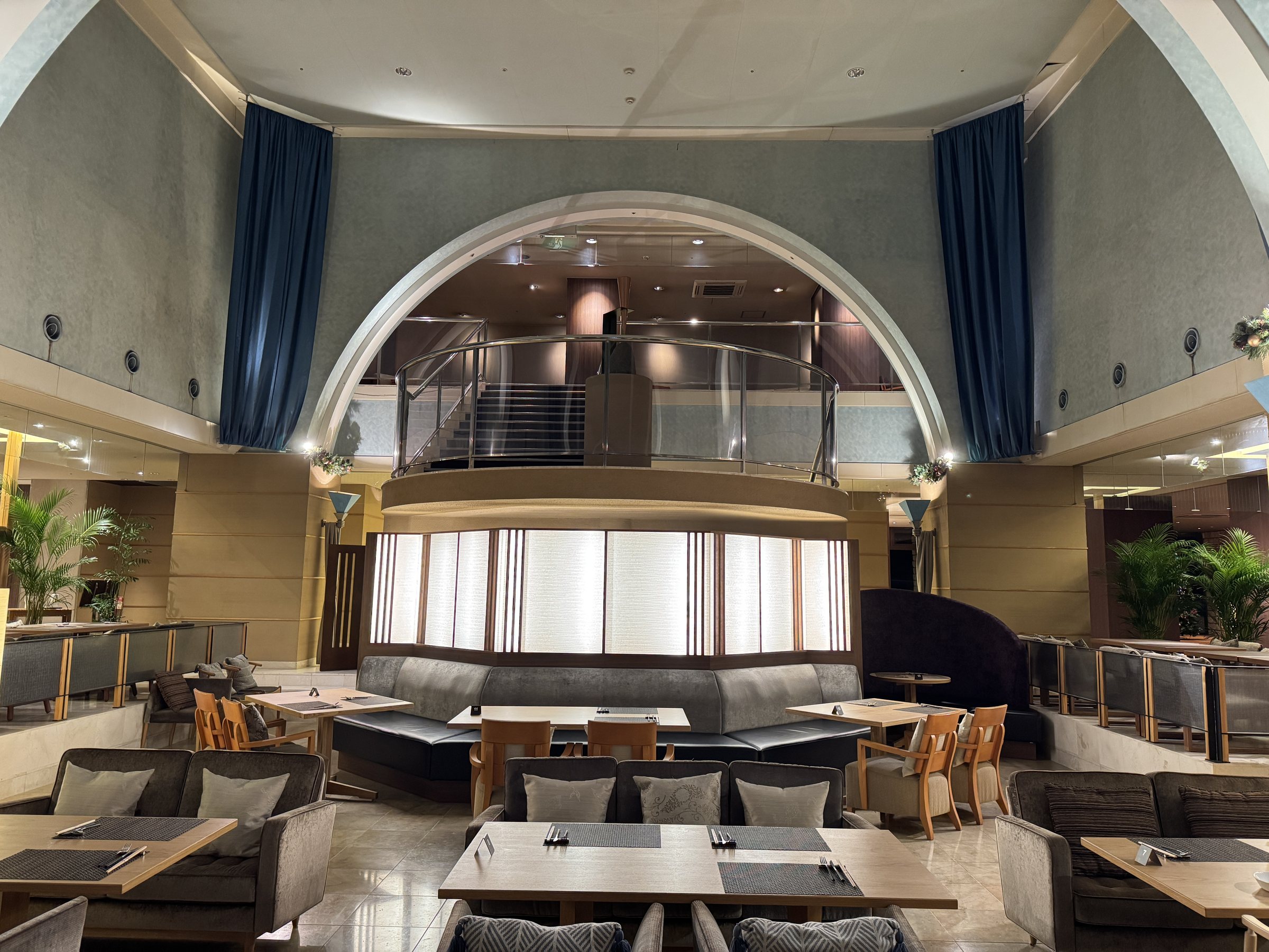 Tables beneath the high arched ceiling.