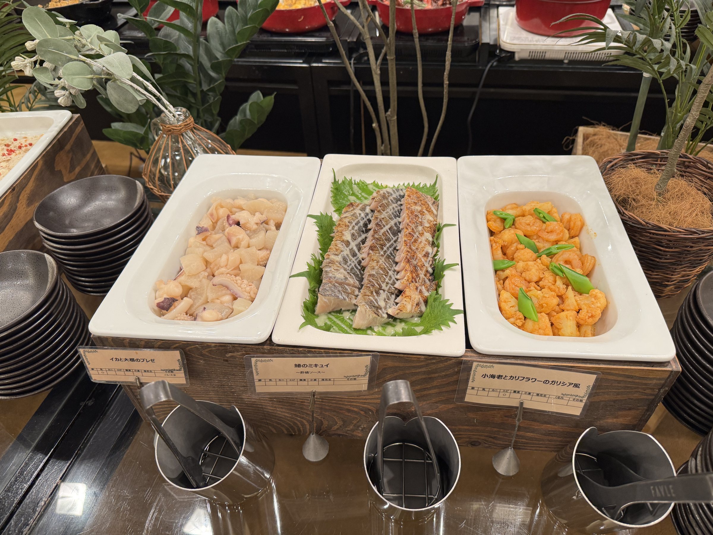 More cold dishes, each with its own label.