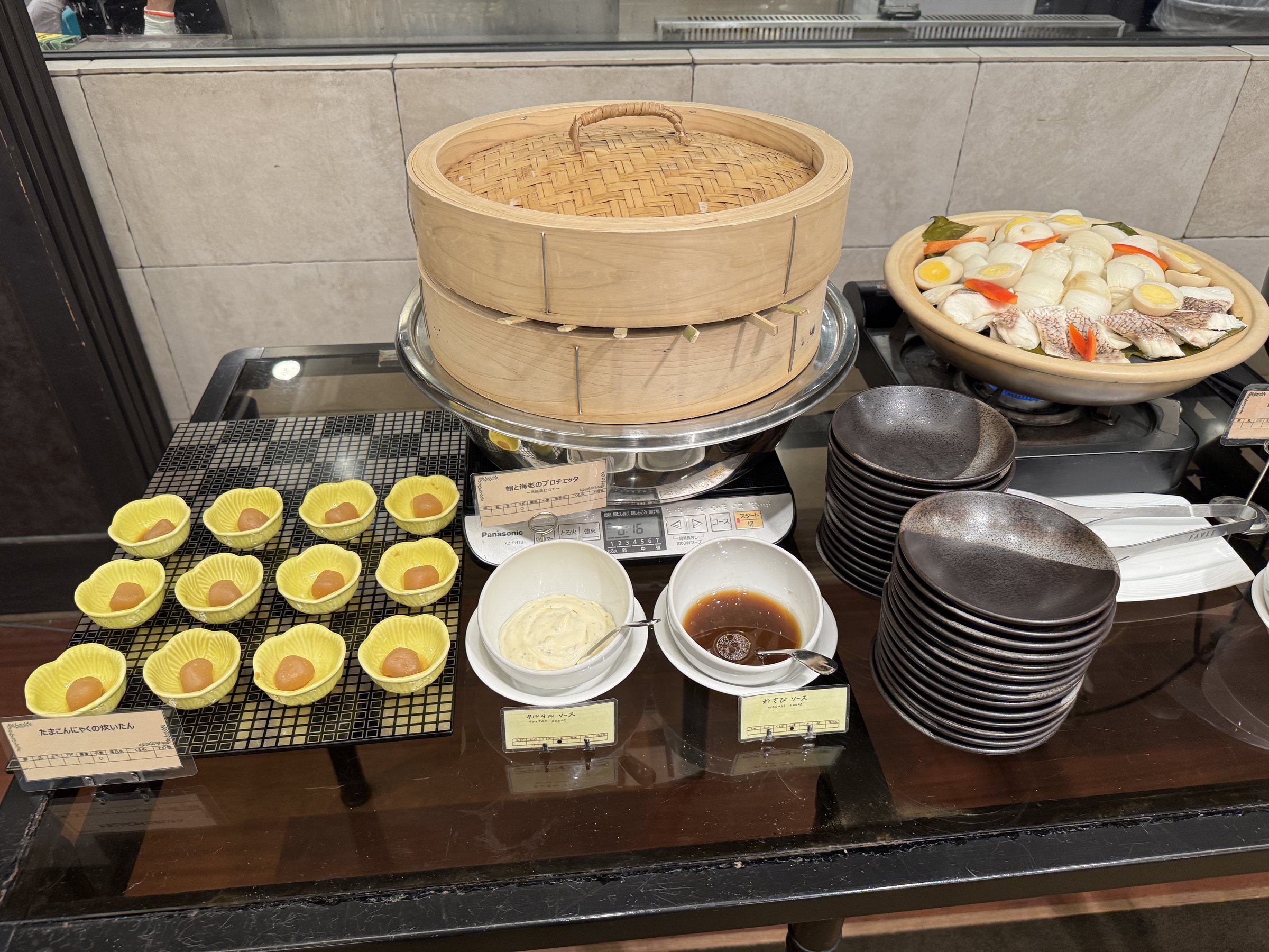 Savory custards and dishes by the bamboo steamer.