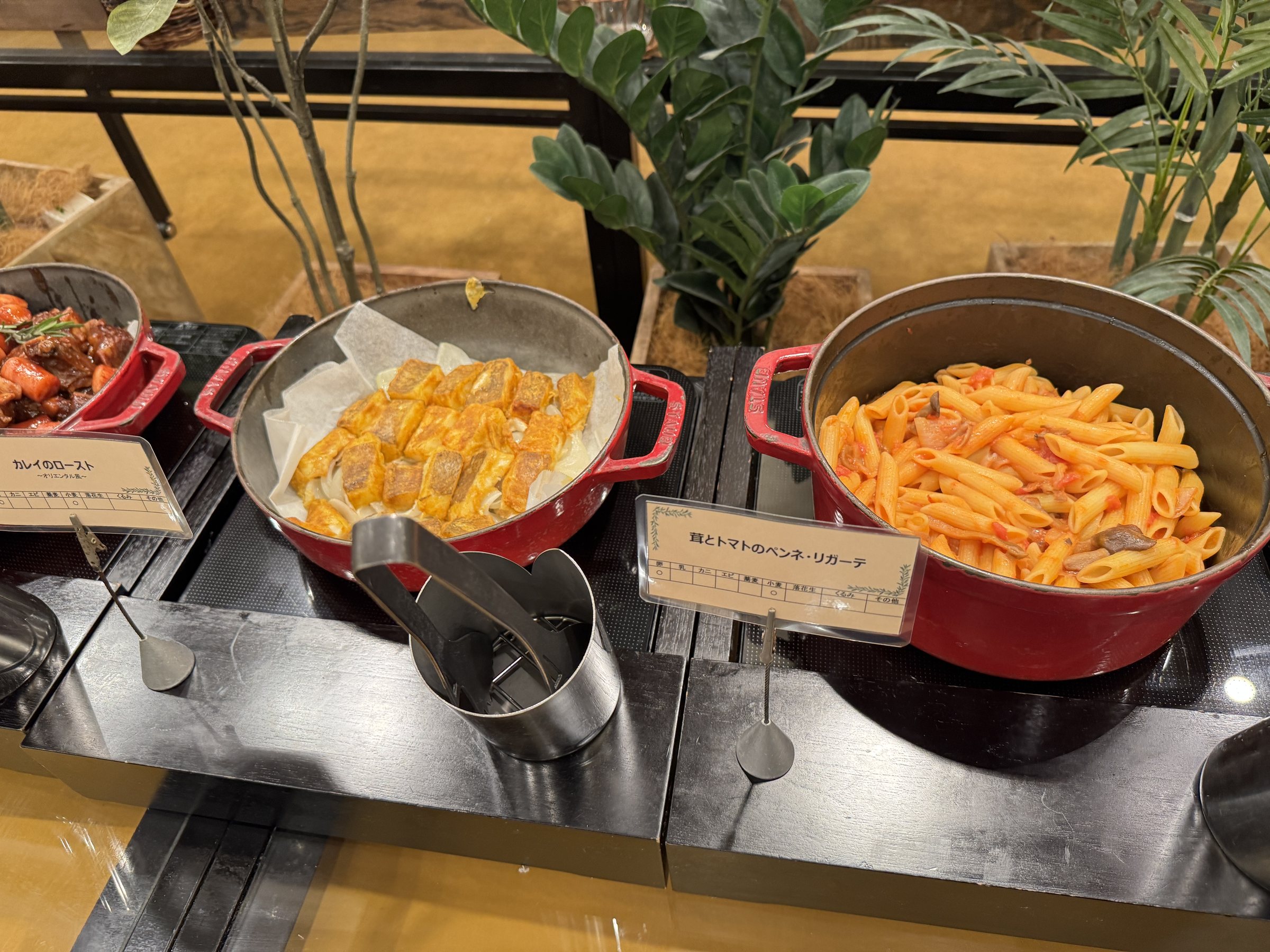 Pasta and other hot dishes in cast-iron pots.