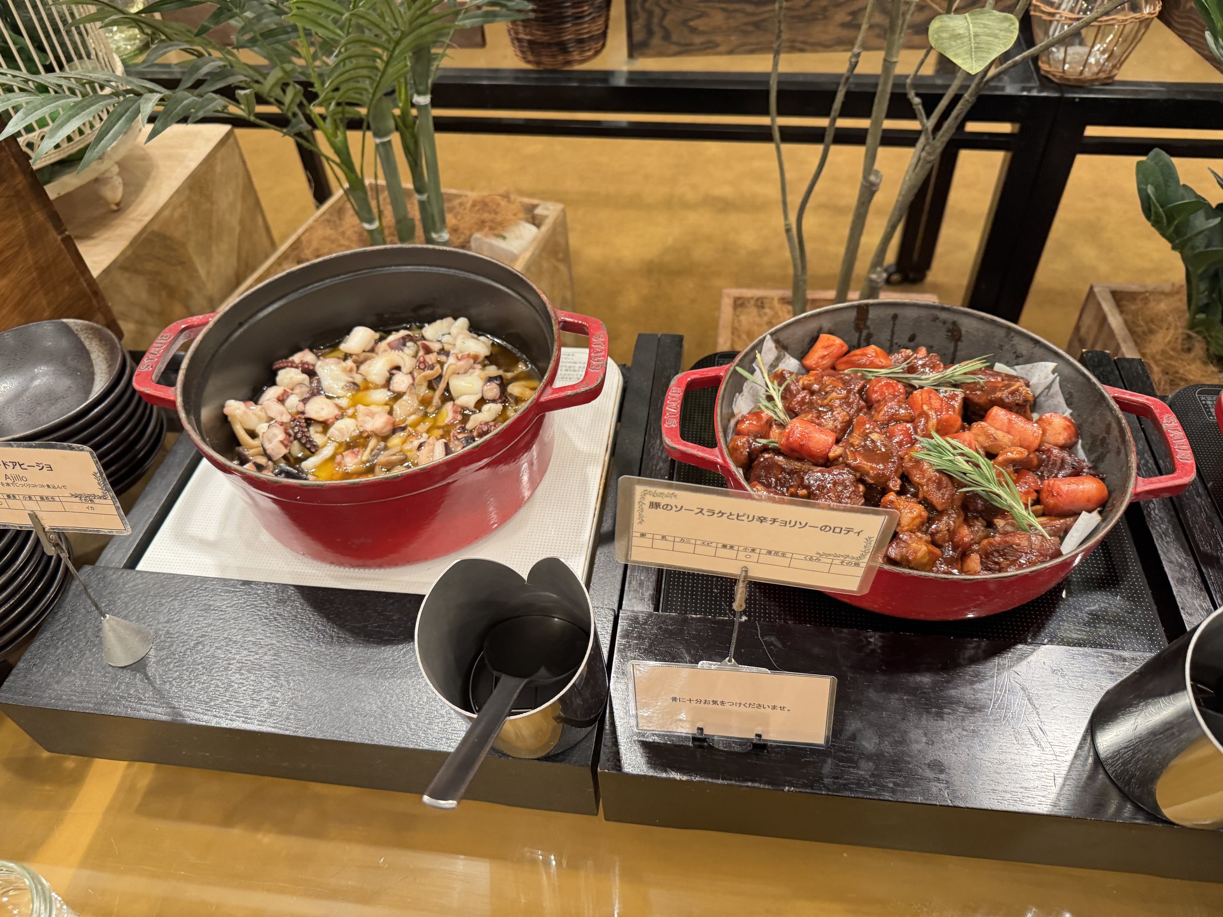 Cast-iron pots of hot dishes on the buffet.