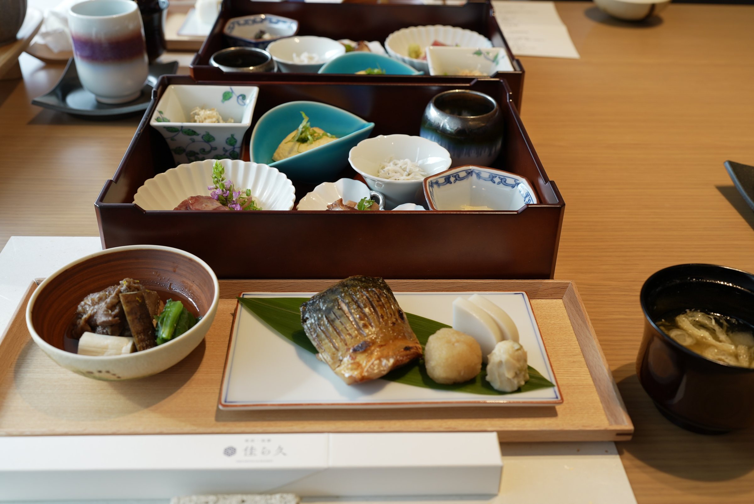 The complete breakfast: rice, miso soup, the obanzai box and grilled fish.