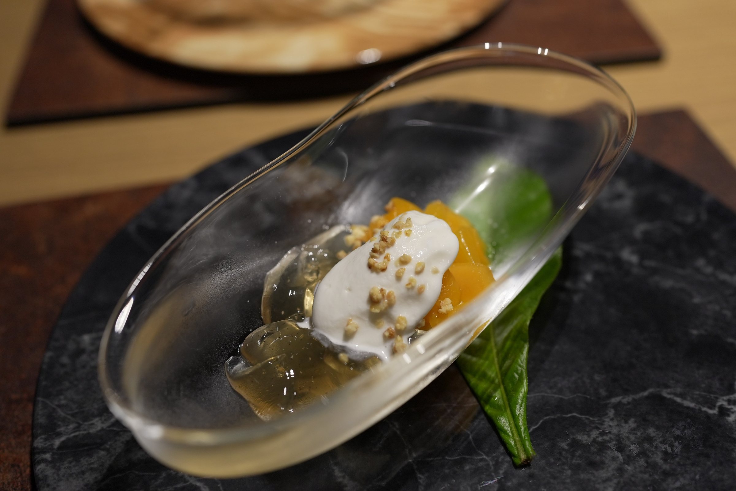 Dessert in a glass dish: loquat and plum jelly.