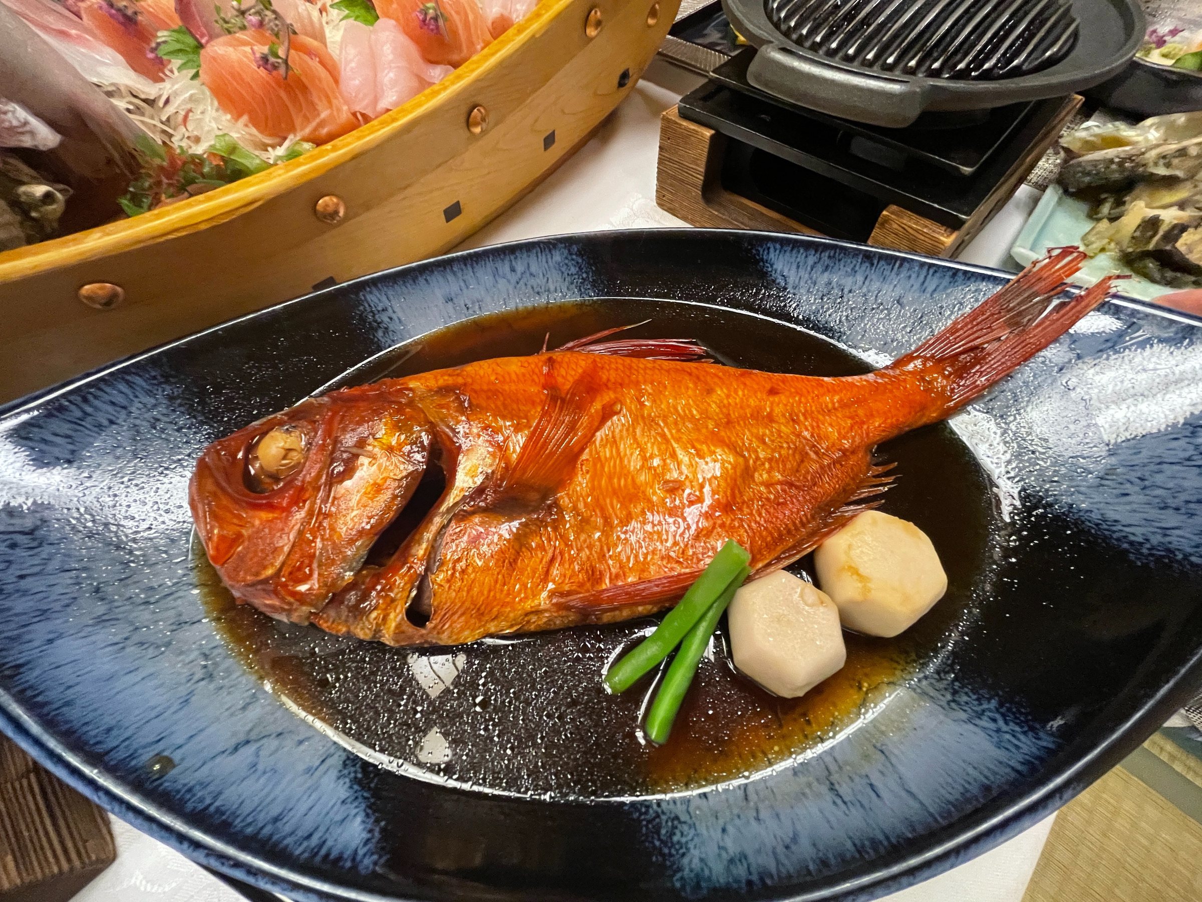 Simmered golden-eye snapper with taro and green beans.