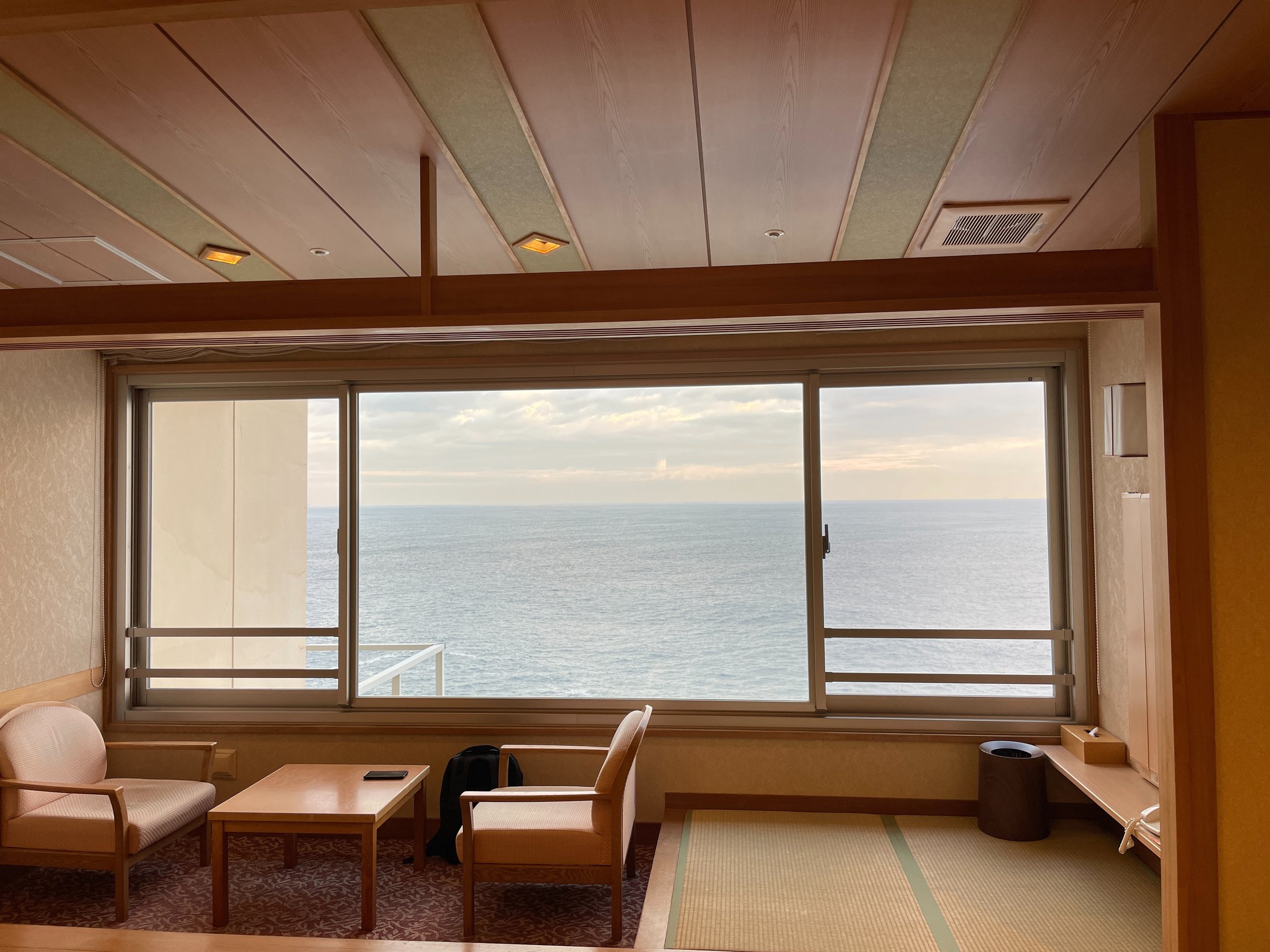 The window alcove: two armchairs facing an unbroken horizon.