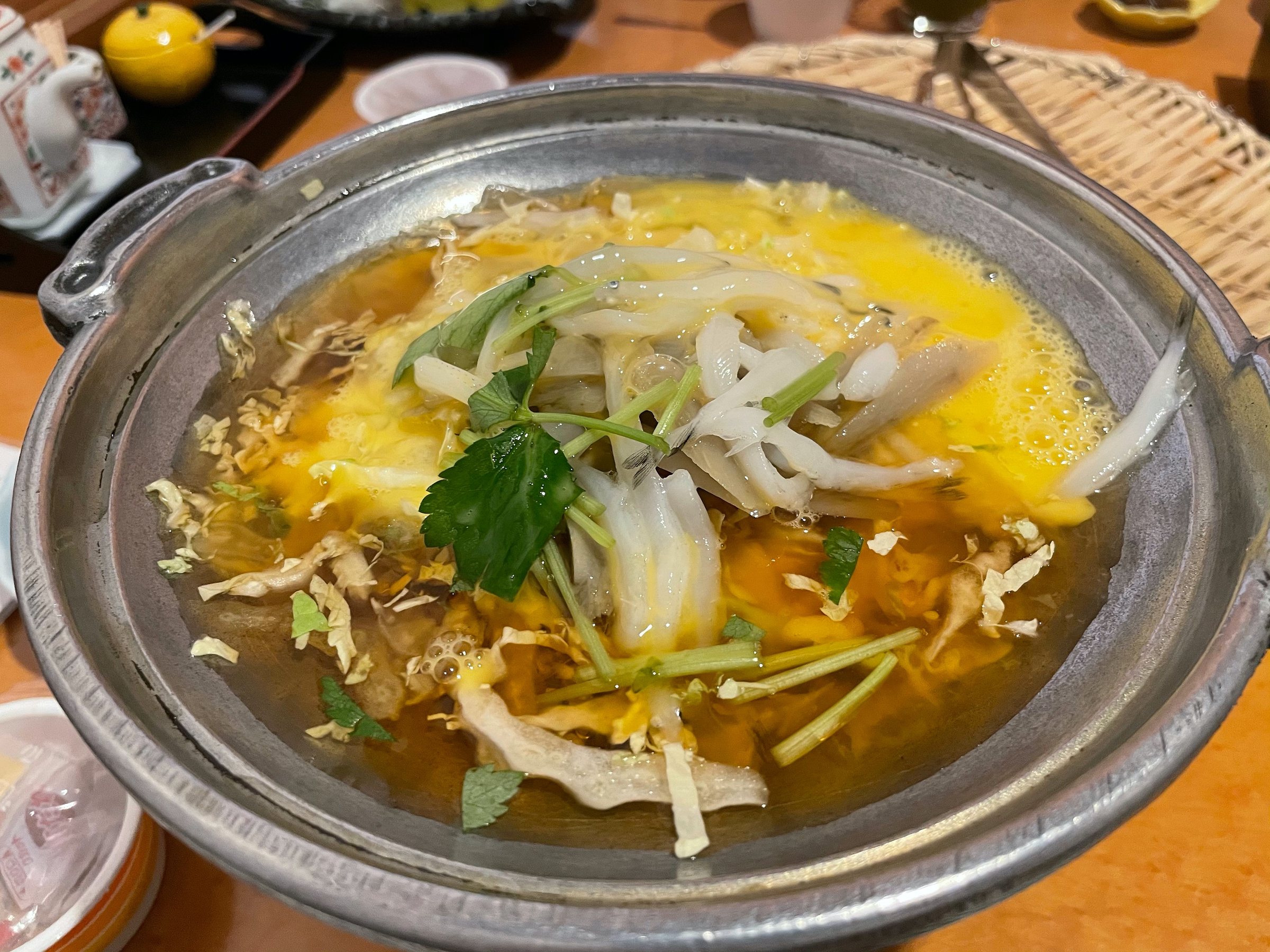 A Yanagawa-style dish set with soft egg.