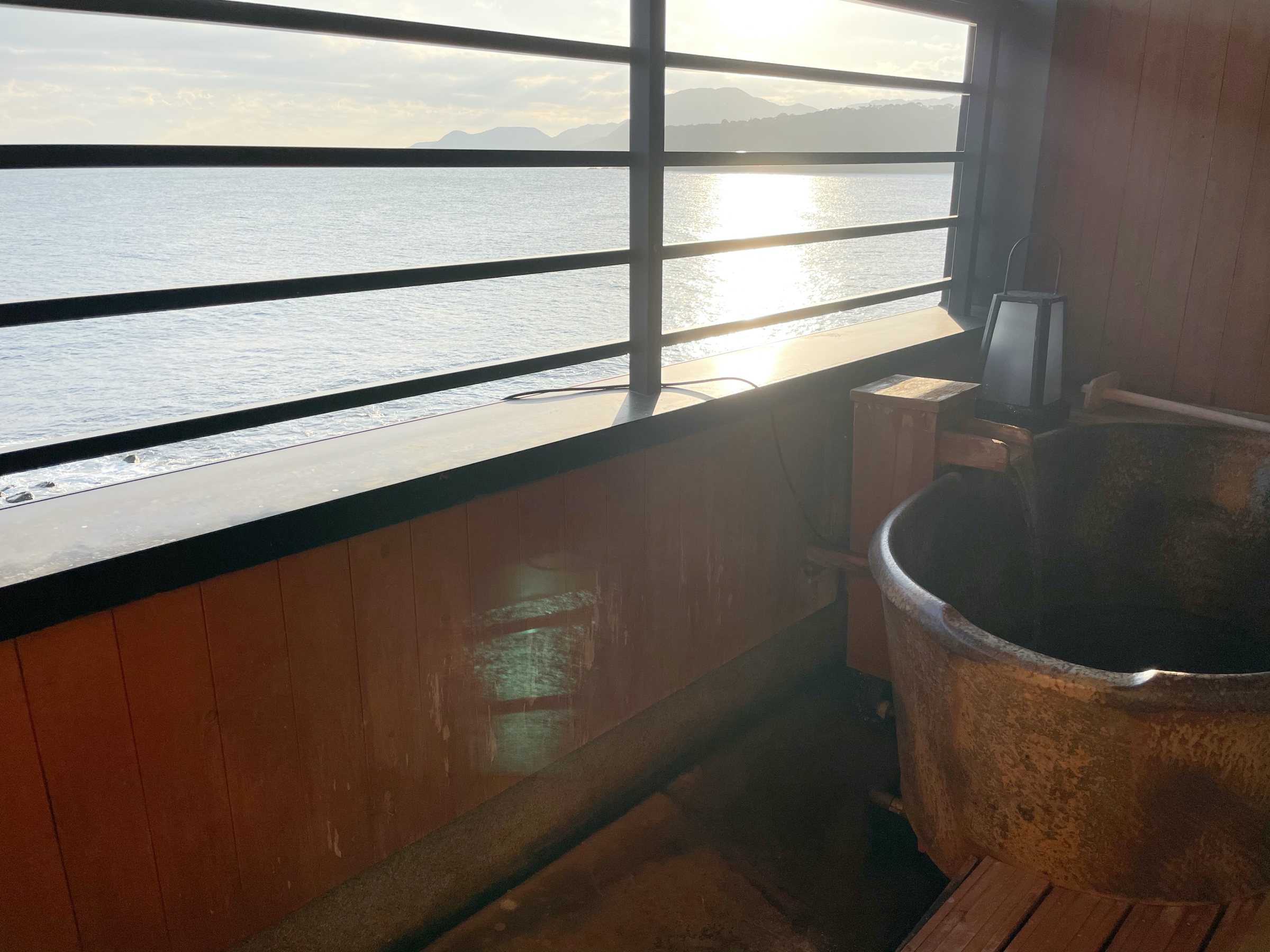 The room's private bath, with the Izu sea glittering beyond the rail.