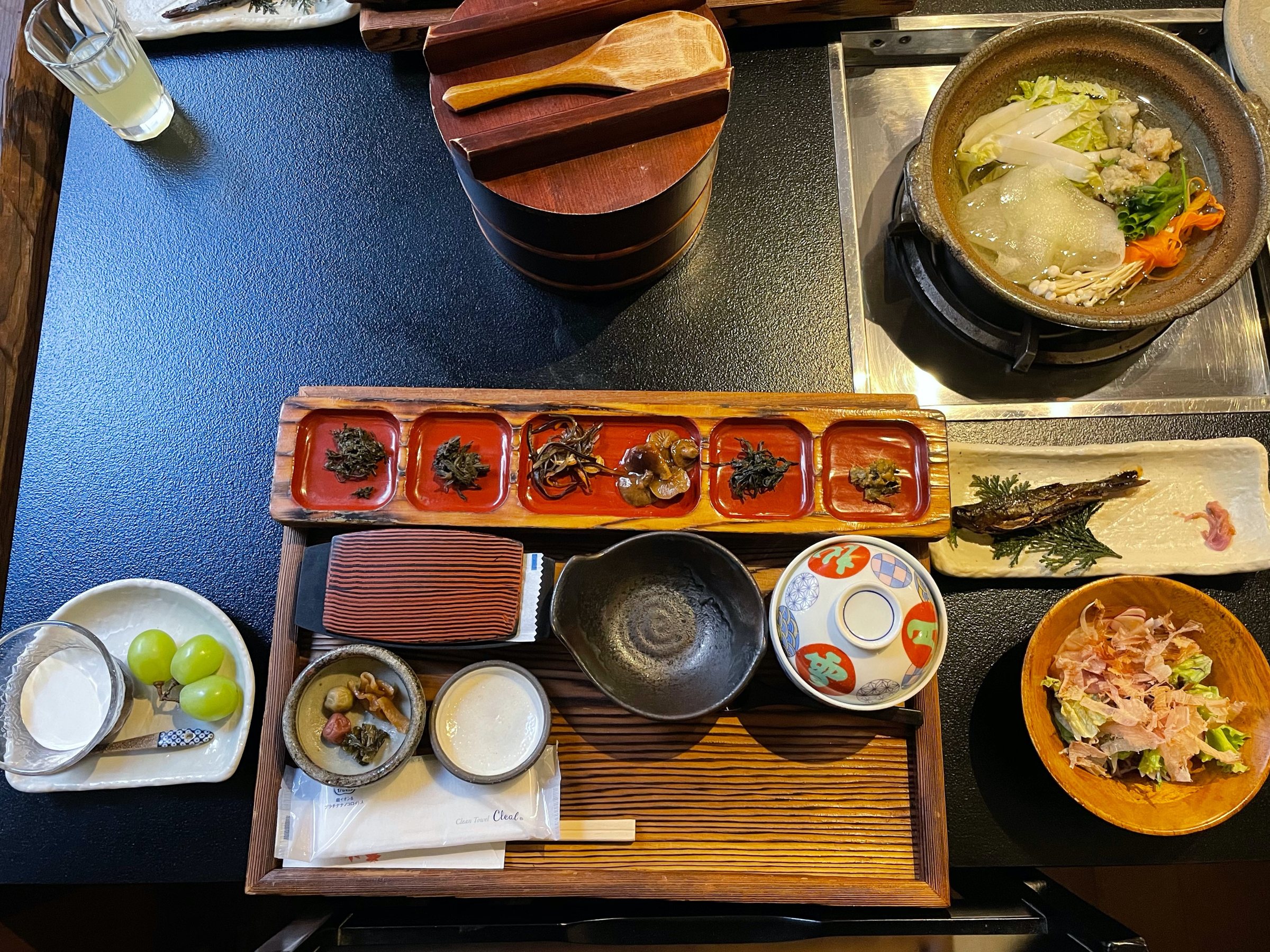 The breakfast tray, with a hot pot simmering above.
