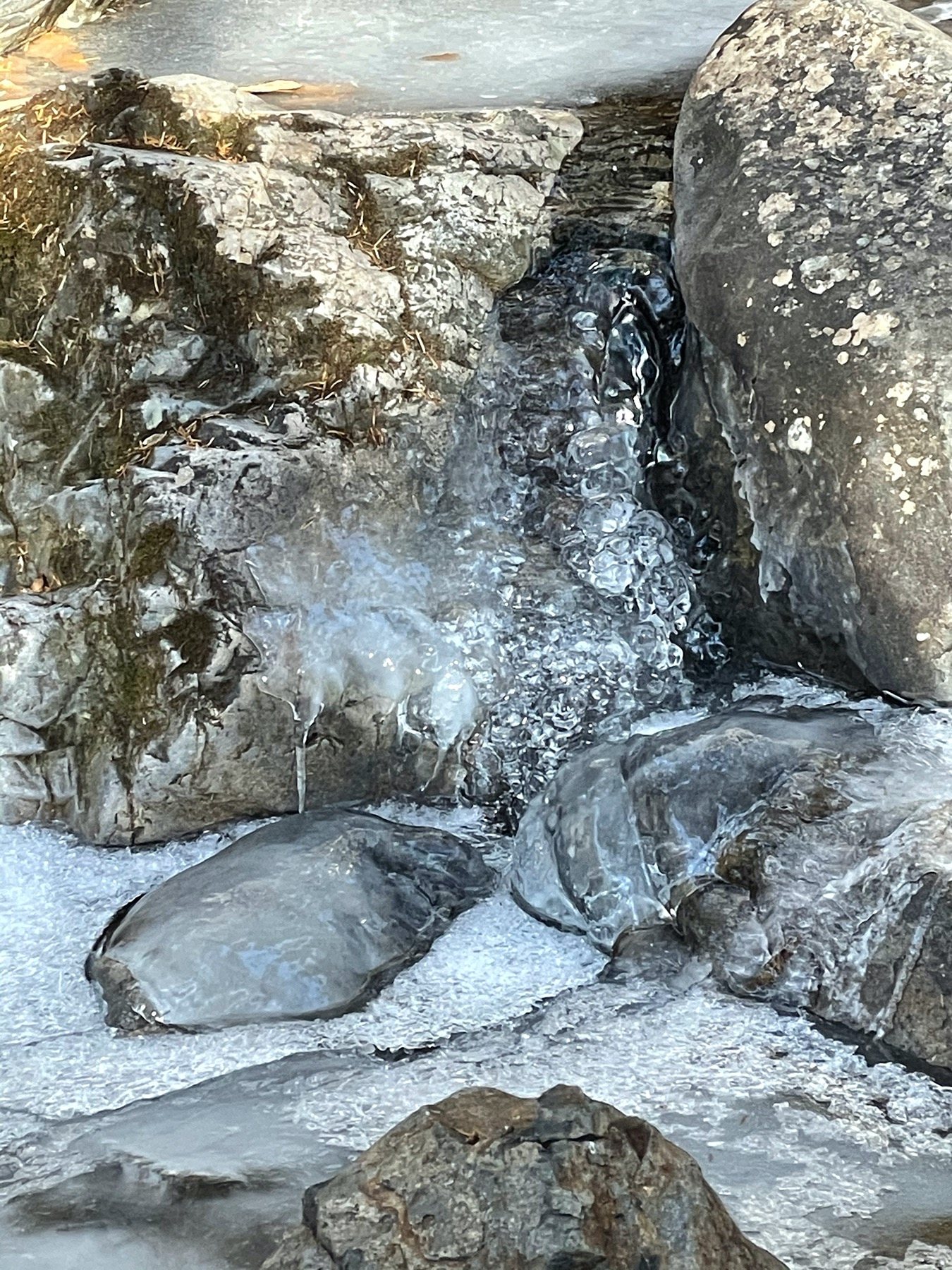 Frozen water clinging to the rocks.