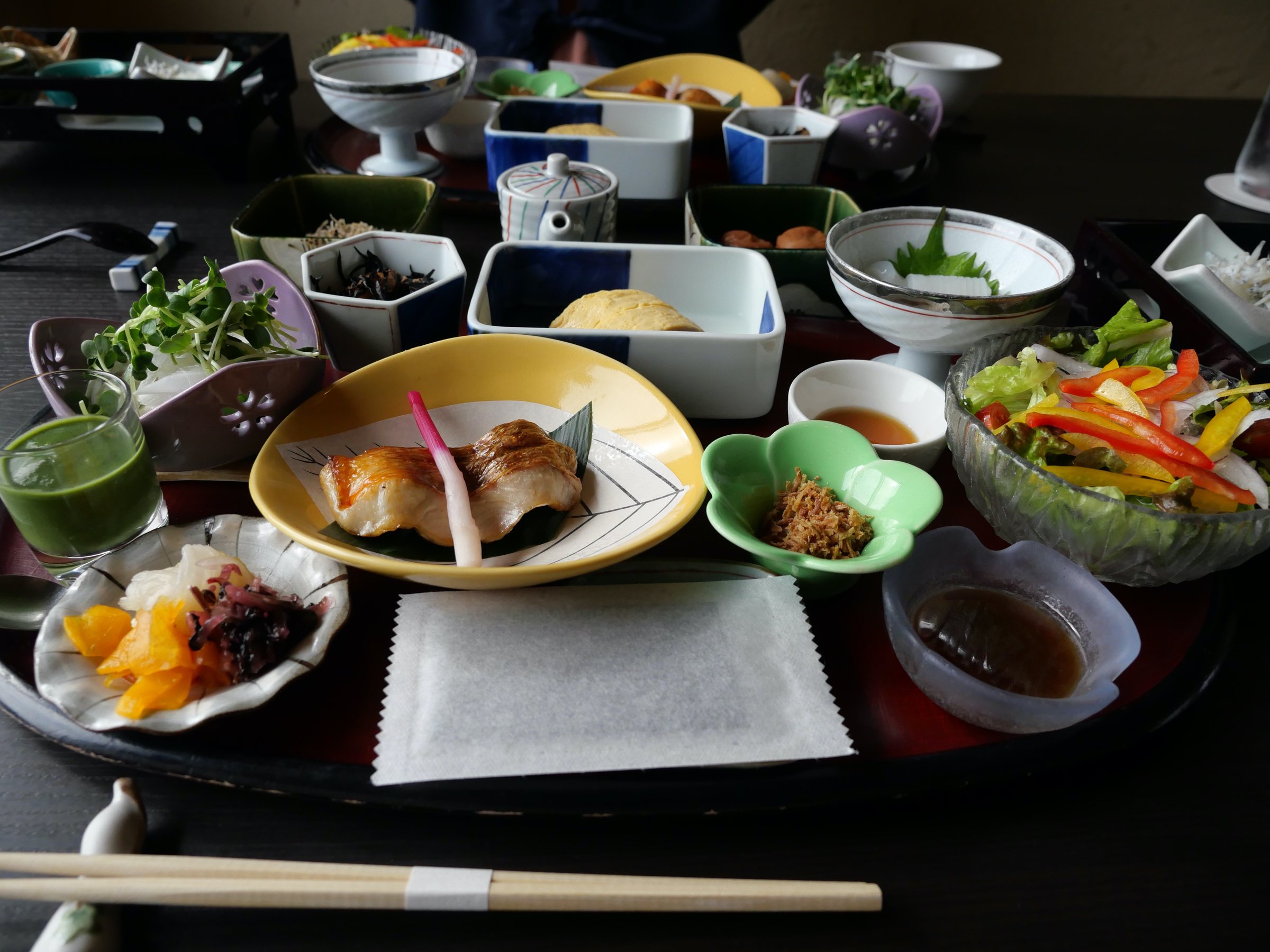 The breakfast tray, covered in small dishes.