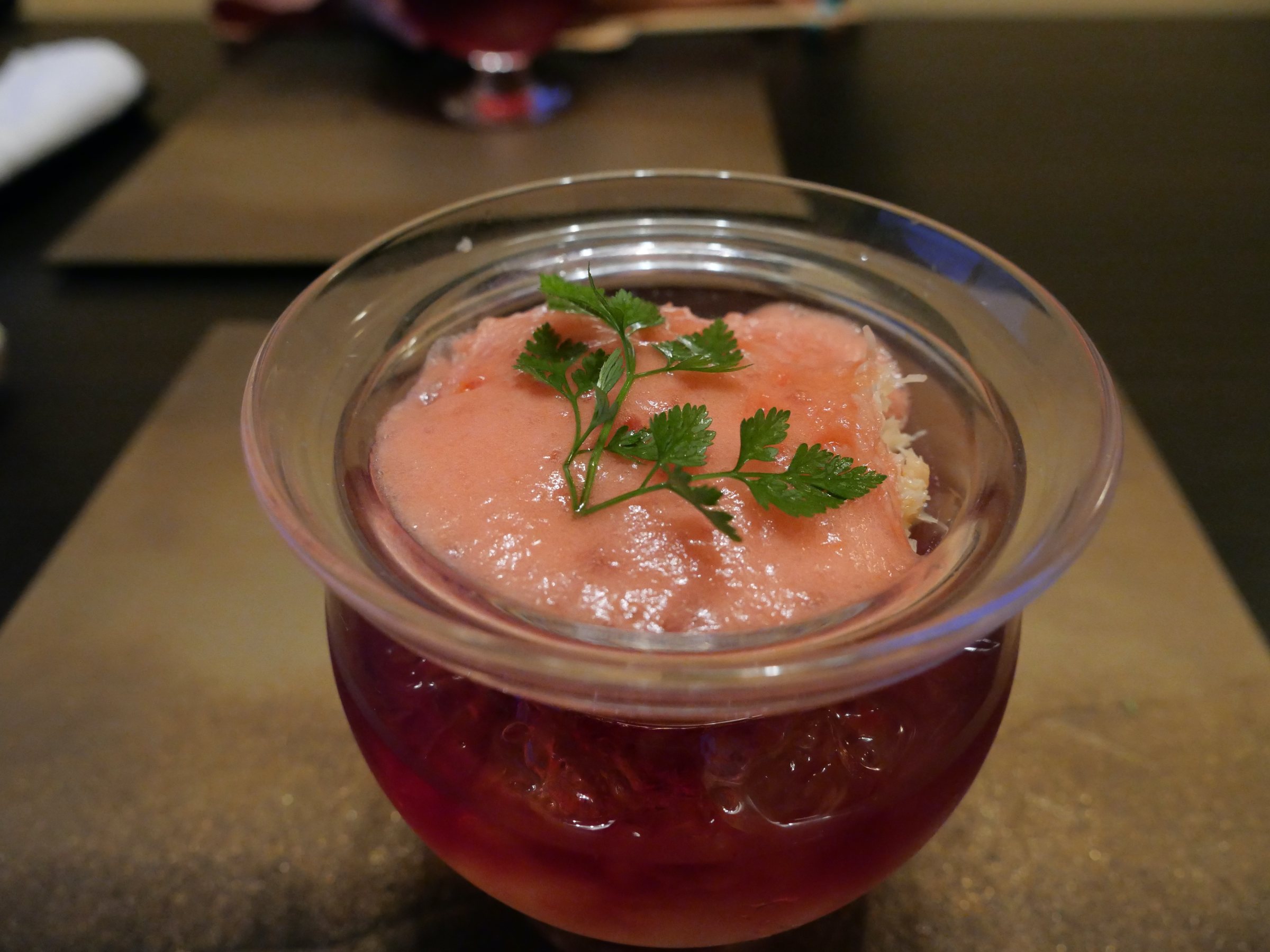 Crab over a ruby jelly, crowned with a pale mousse.
