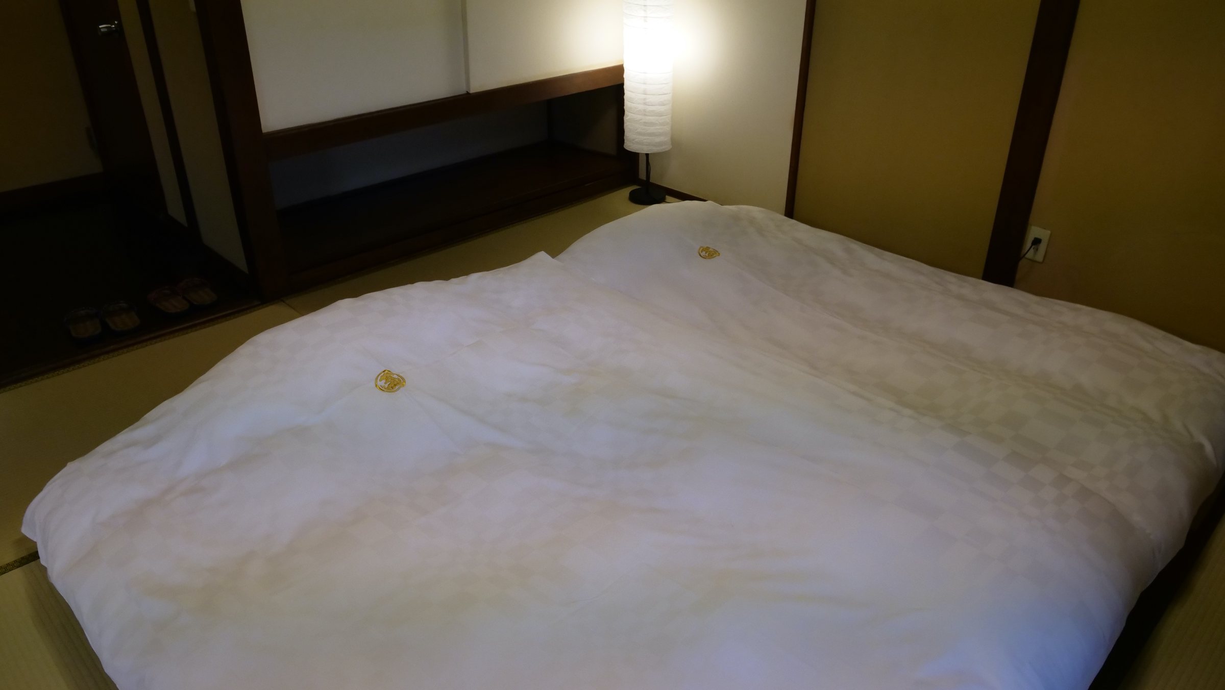A plump futon laid on the tatami.