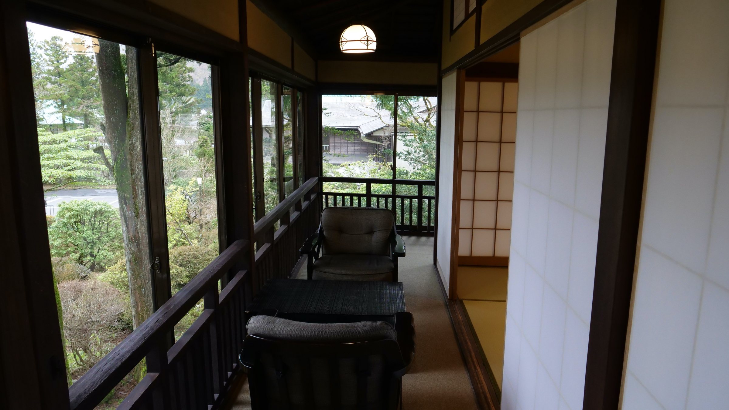 The veranda, with armchairs facing the garden.
