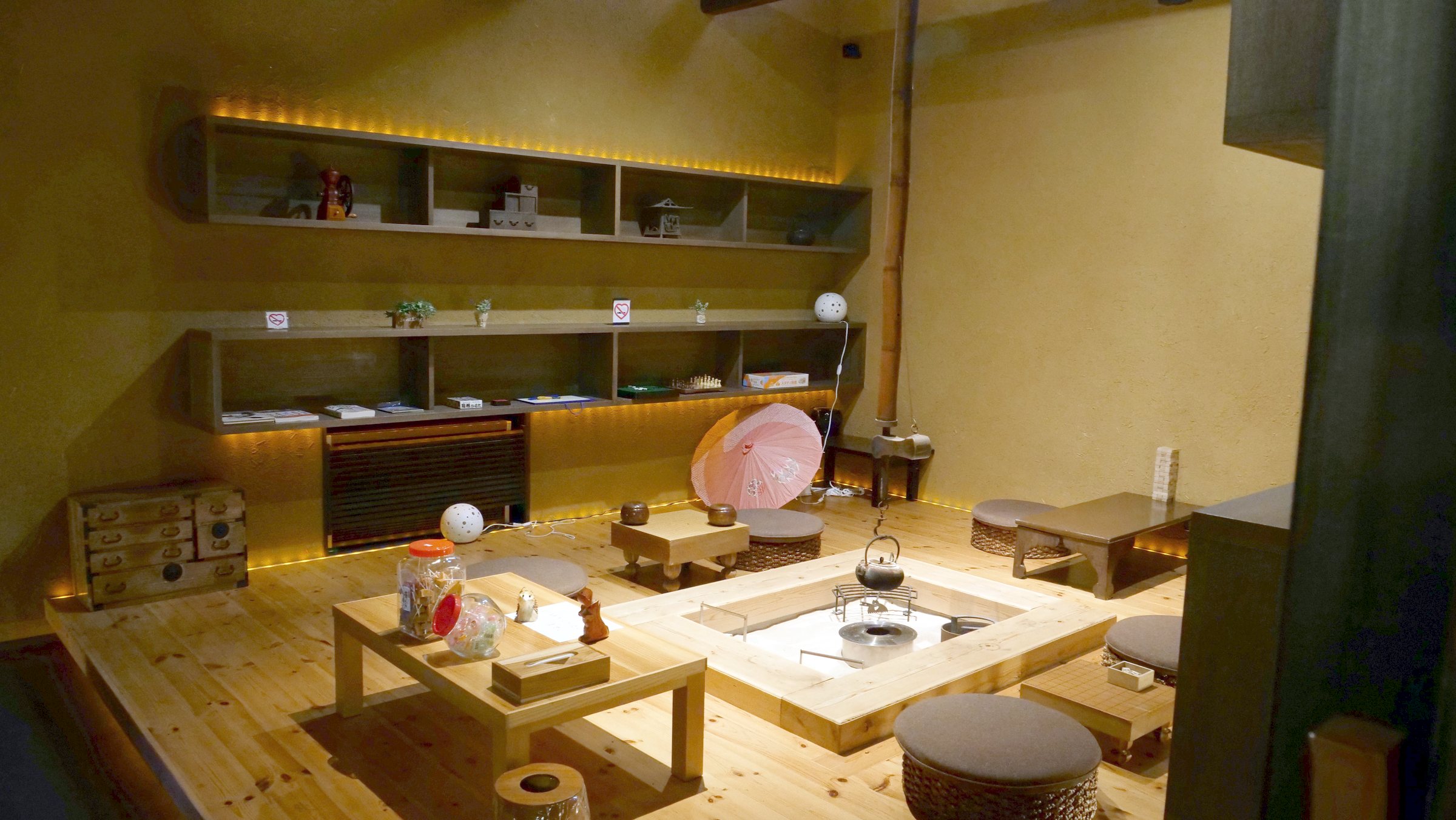 A traditional sitting room arranged around a sunken hearth.