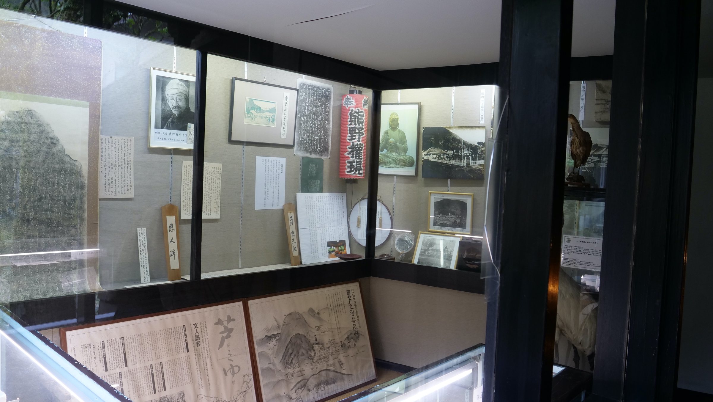 Display cases of photographs, letters and documents from the ryokan's history.