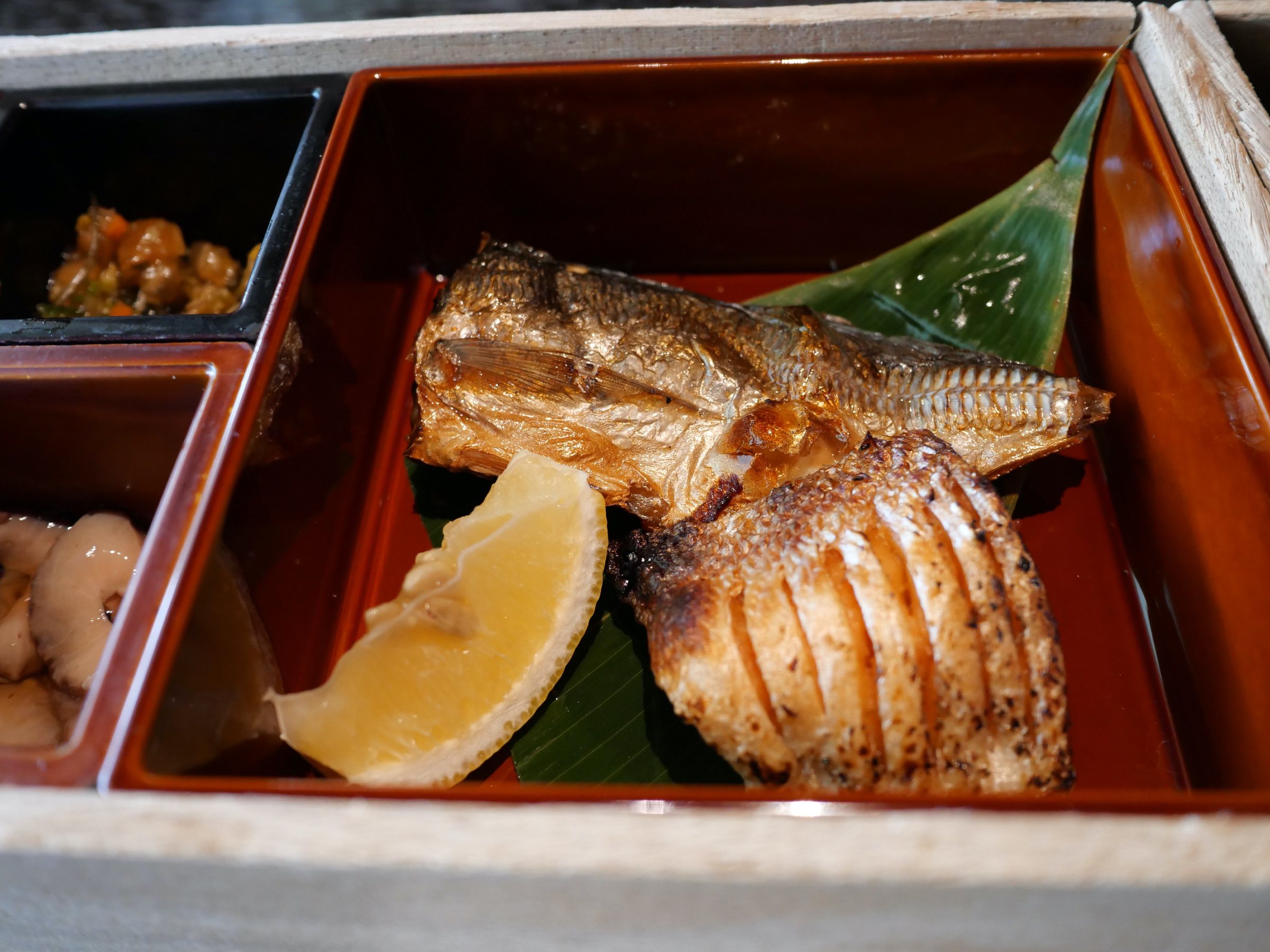 The dried fish, grilled crisp, with lemon.