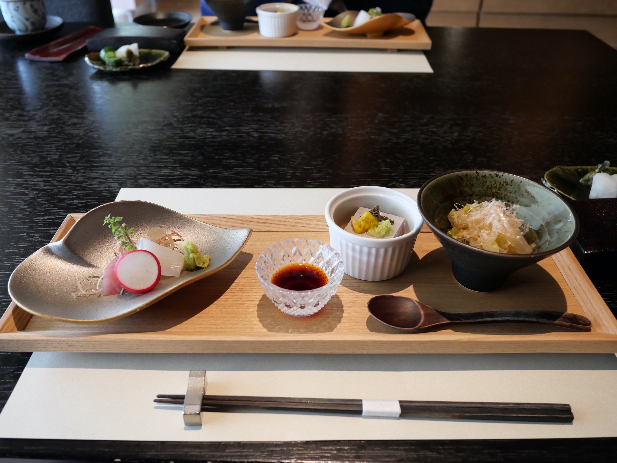 The first breakfast plate, with radish and small bowls.