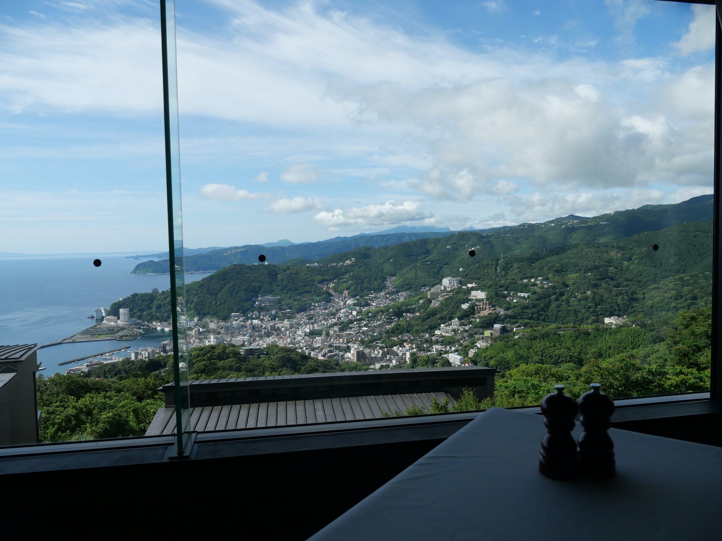 Breakfast with a view: Atami's coastline beyond the glass.