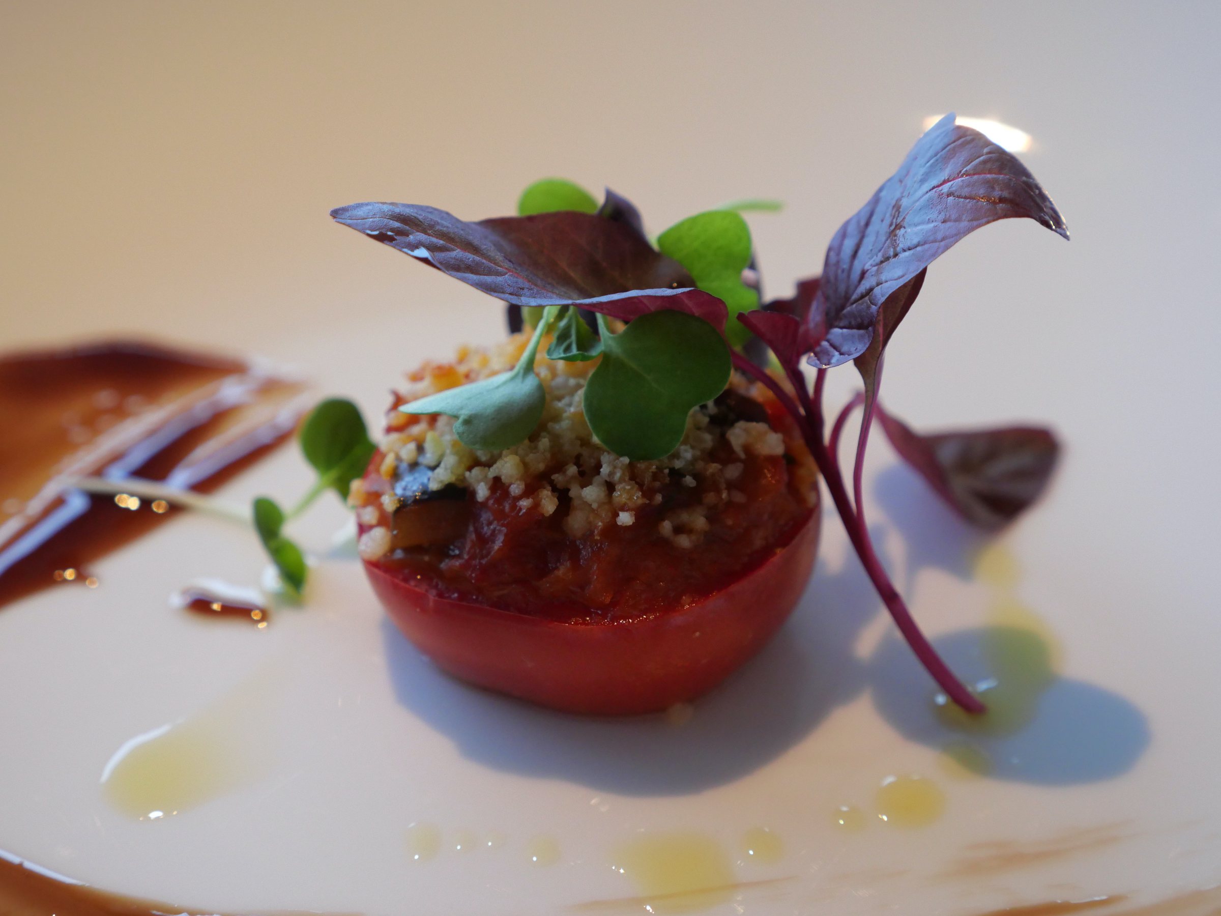 Shizuoka tomato crumble, crowned with leaves and shoots.