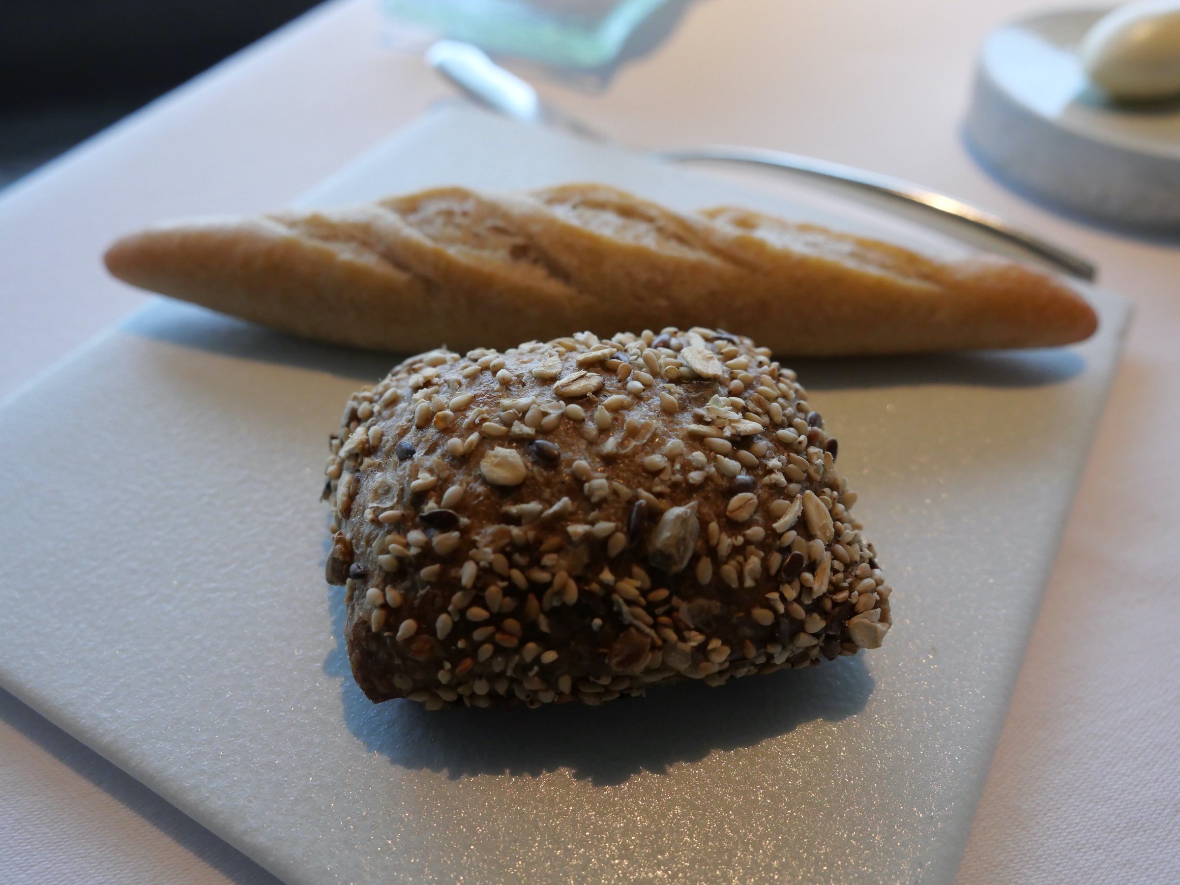 Wholemeal bread and a slim baguette.