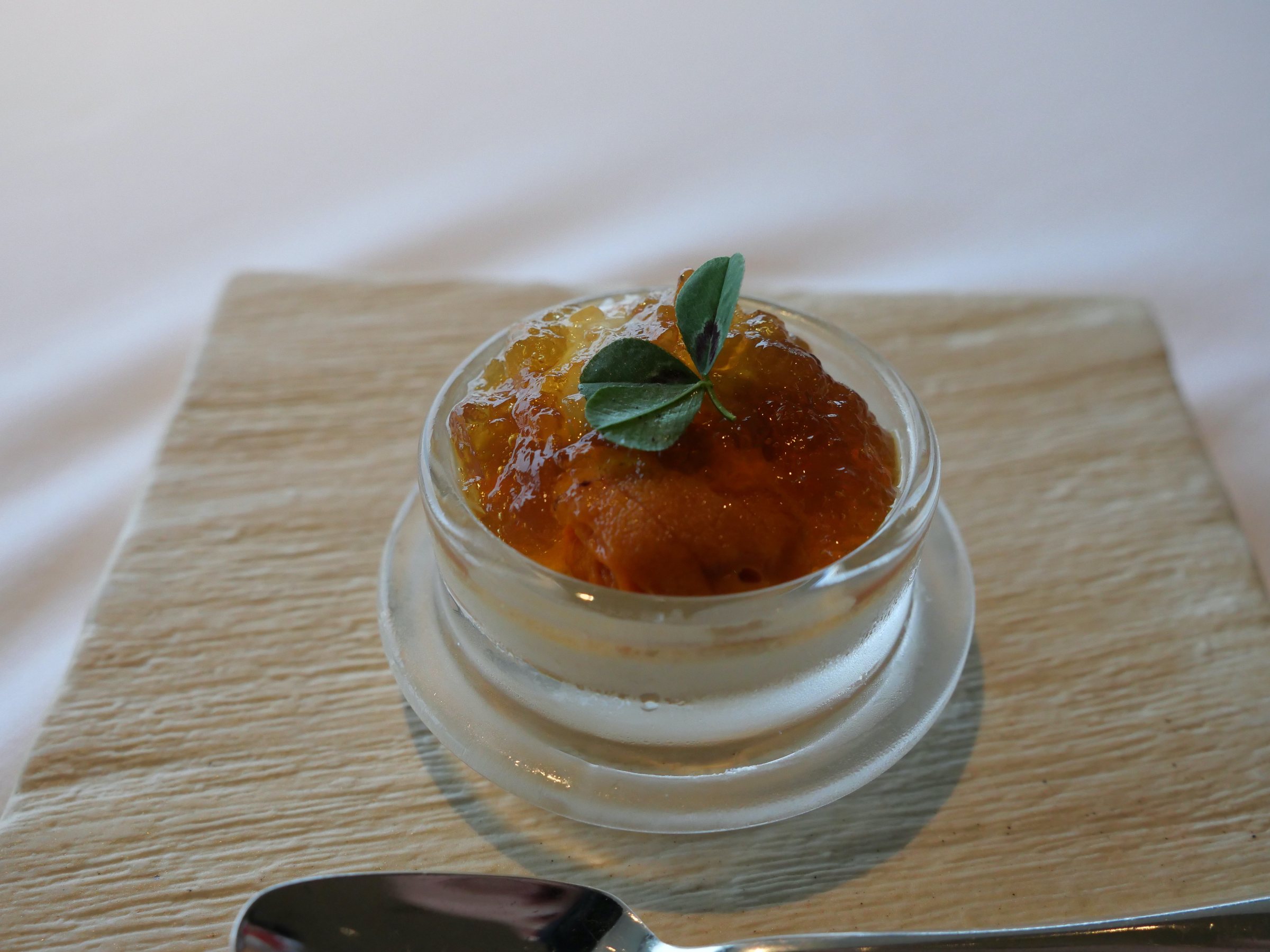 Summer sea urchin and botan shrimp jelly in a small glass.