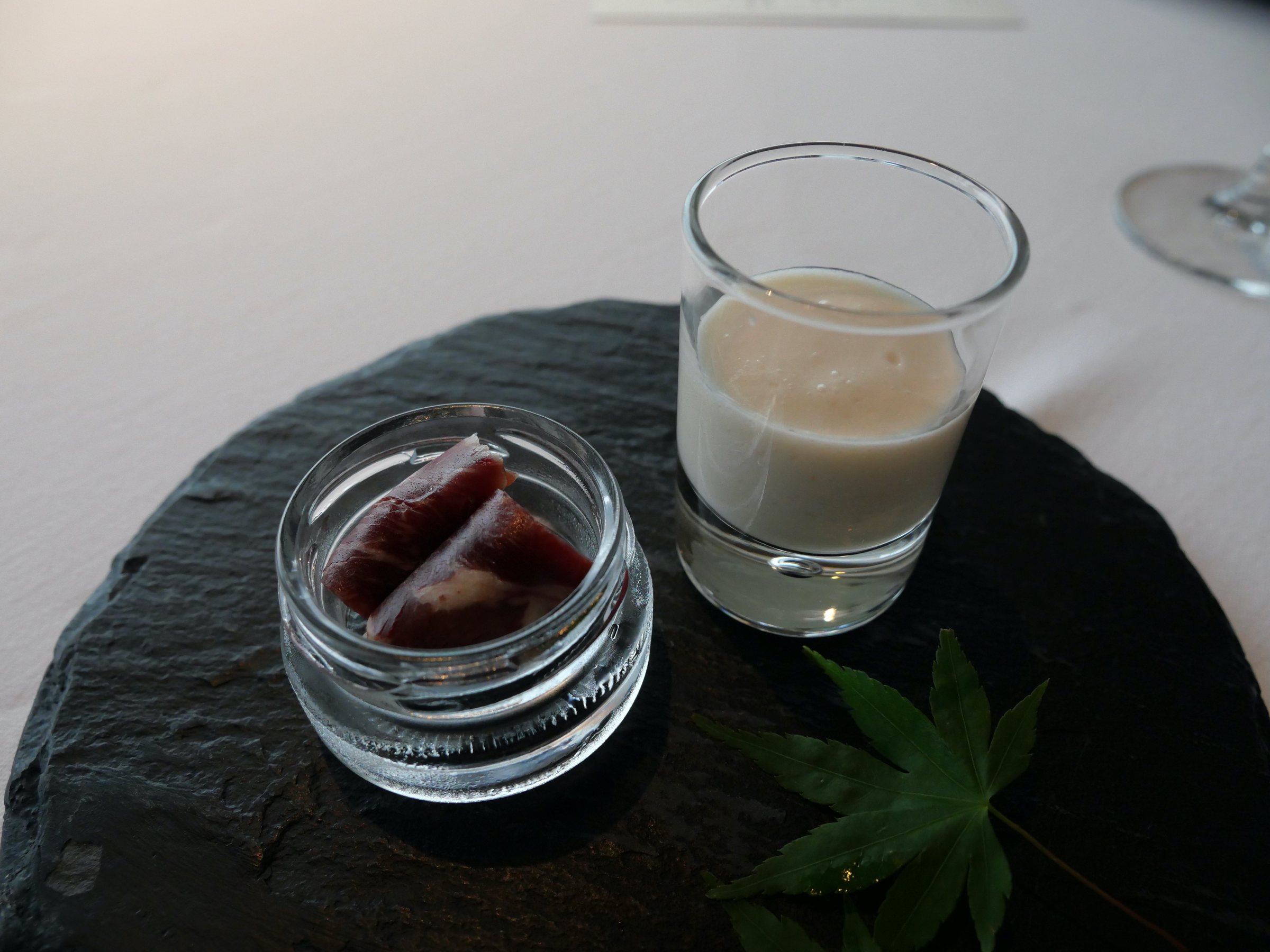 The opening course, served in glassware on slate.